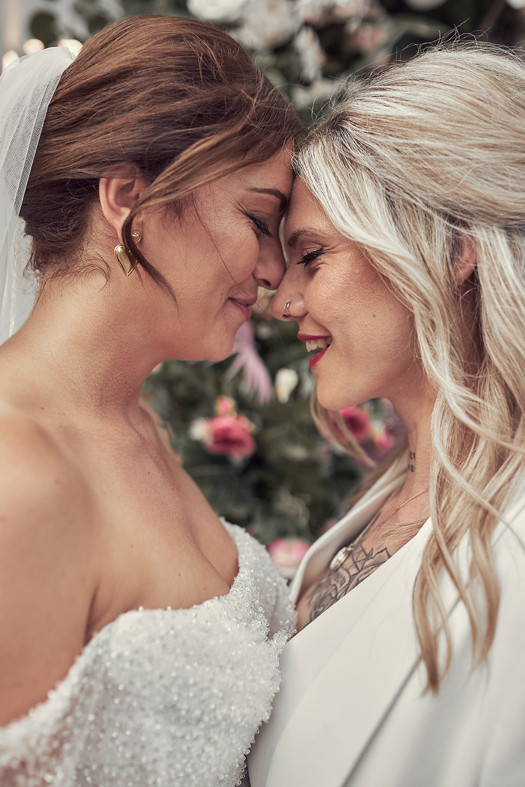 close up shot of brides leaning each other's forehead