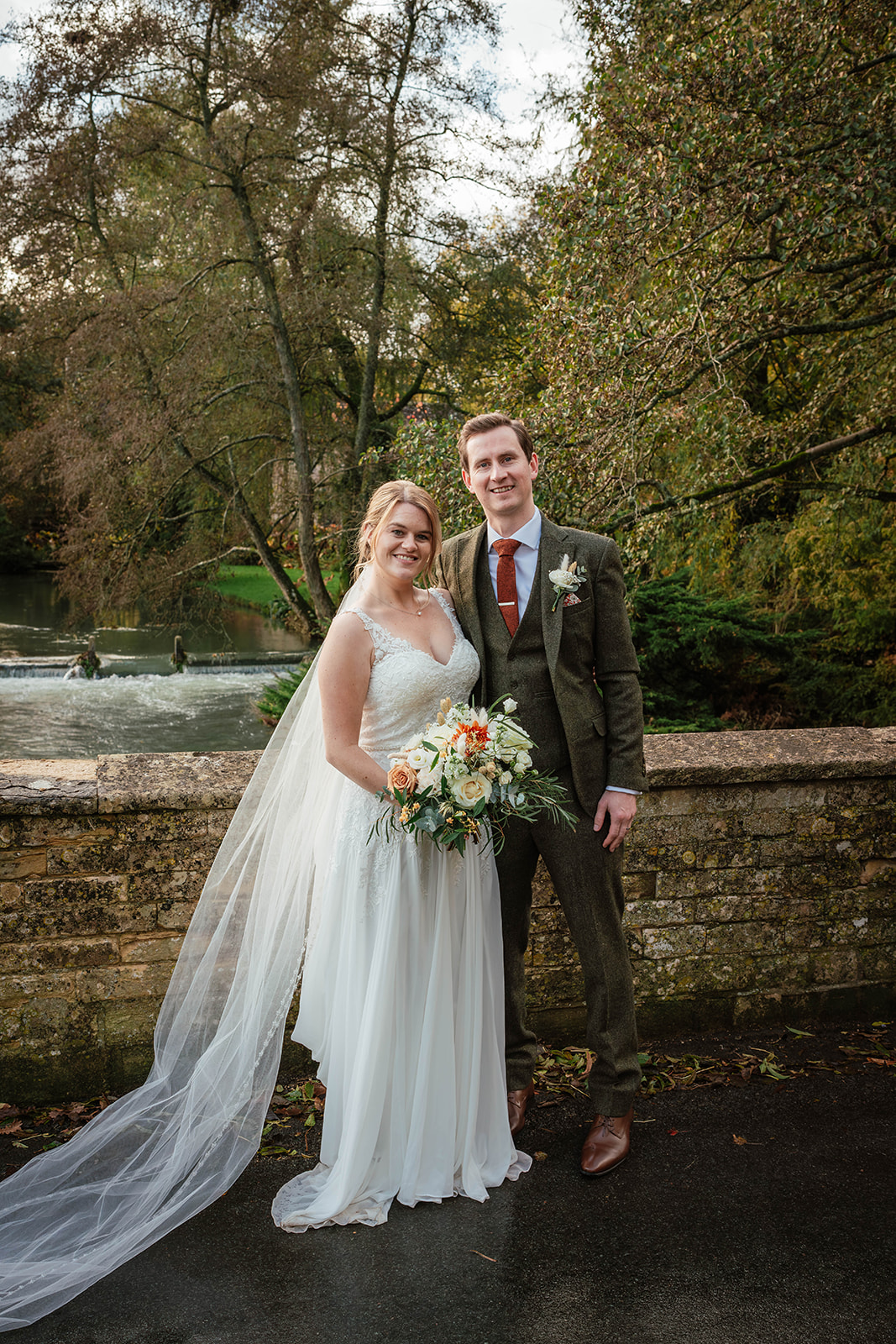 bride and groom on river Zara Davis Photography Wild Thyme and Honey Cirencester Cotswolds Gloucestershire