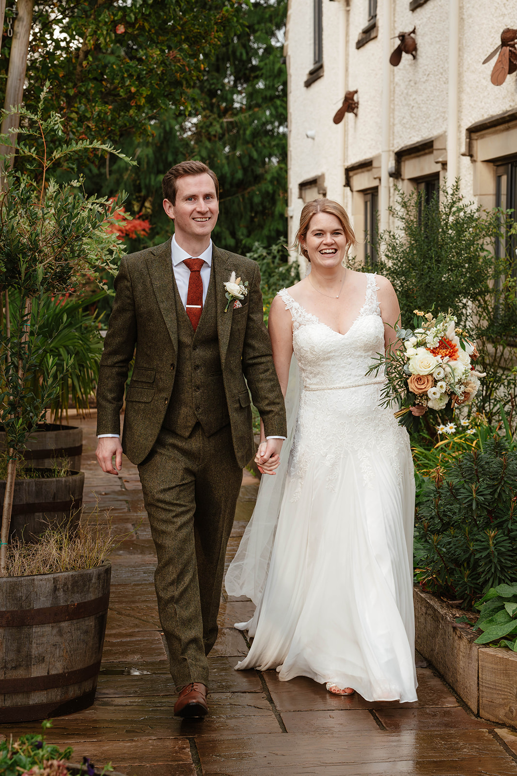 bride and groom outside venue Zara Davis Photography Wild Thyme and Honey Cirencester Cotswolds Gloucestershire