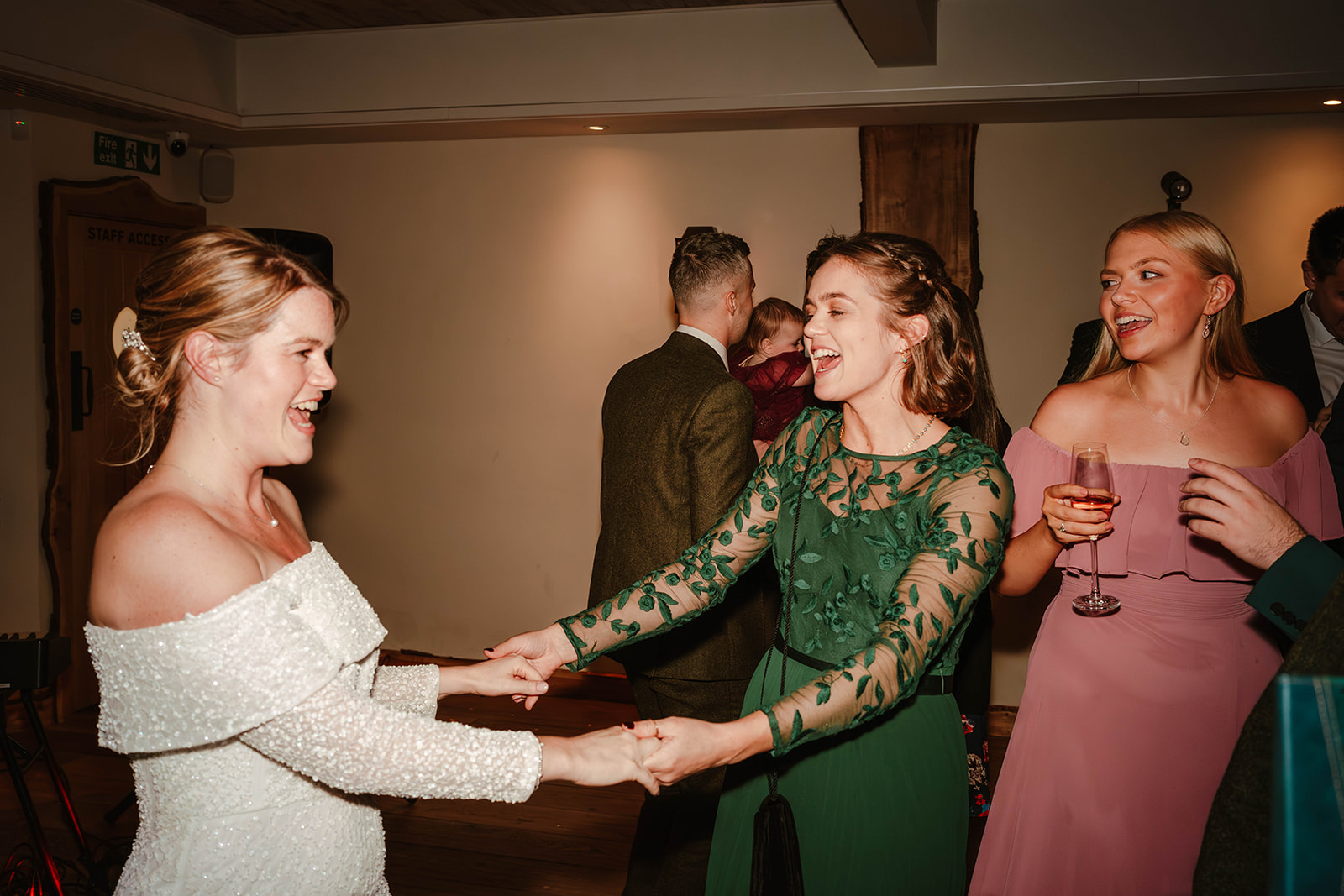 bride and sister dancing Zara Davis Photography Wild Thyme and Honey Cirencester Cotswolds Gloucestershire