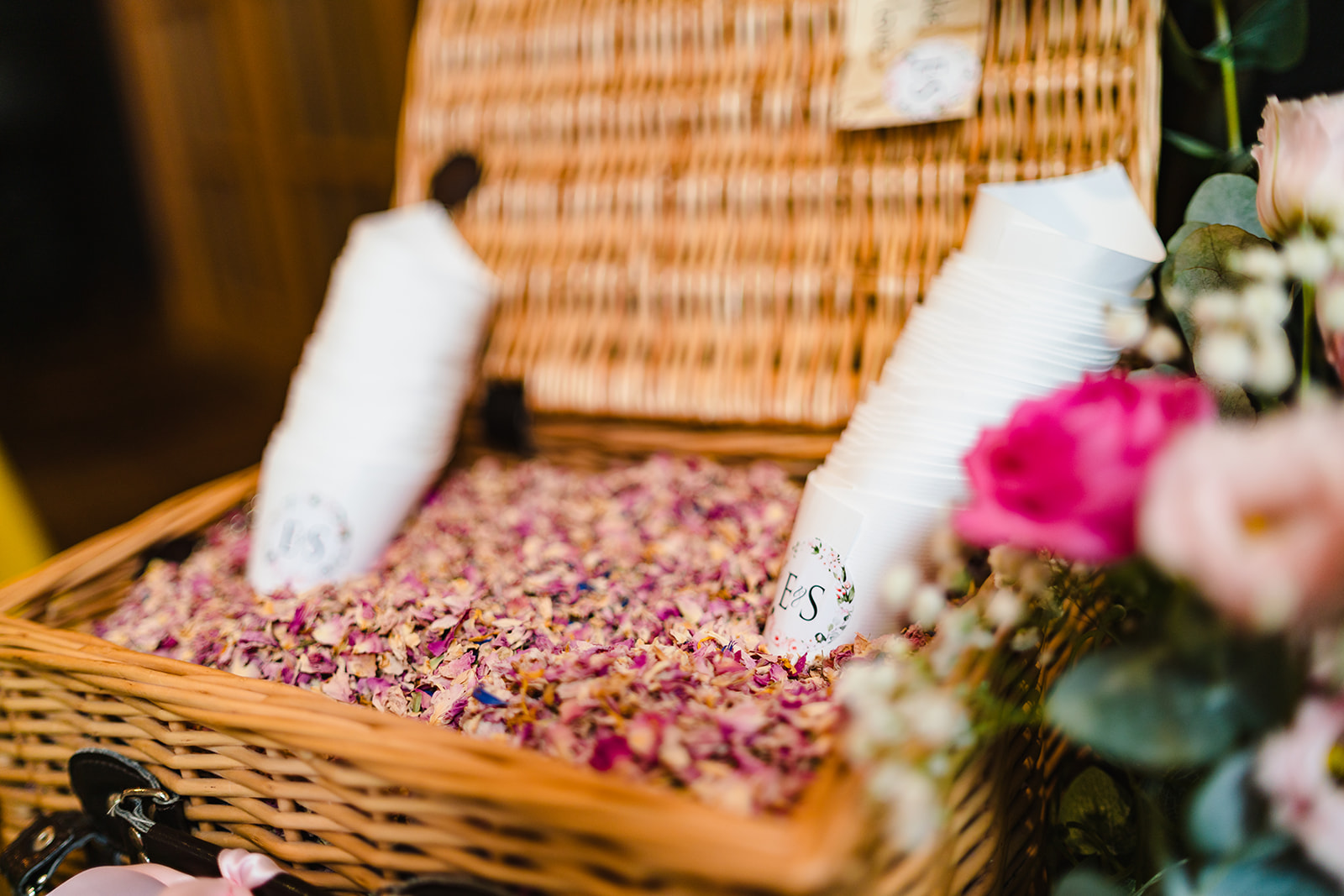 couple use their grandmothers basket for wedding confetti