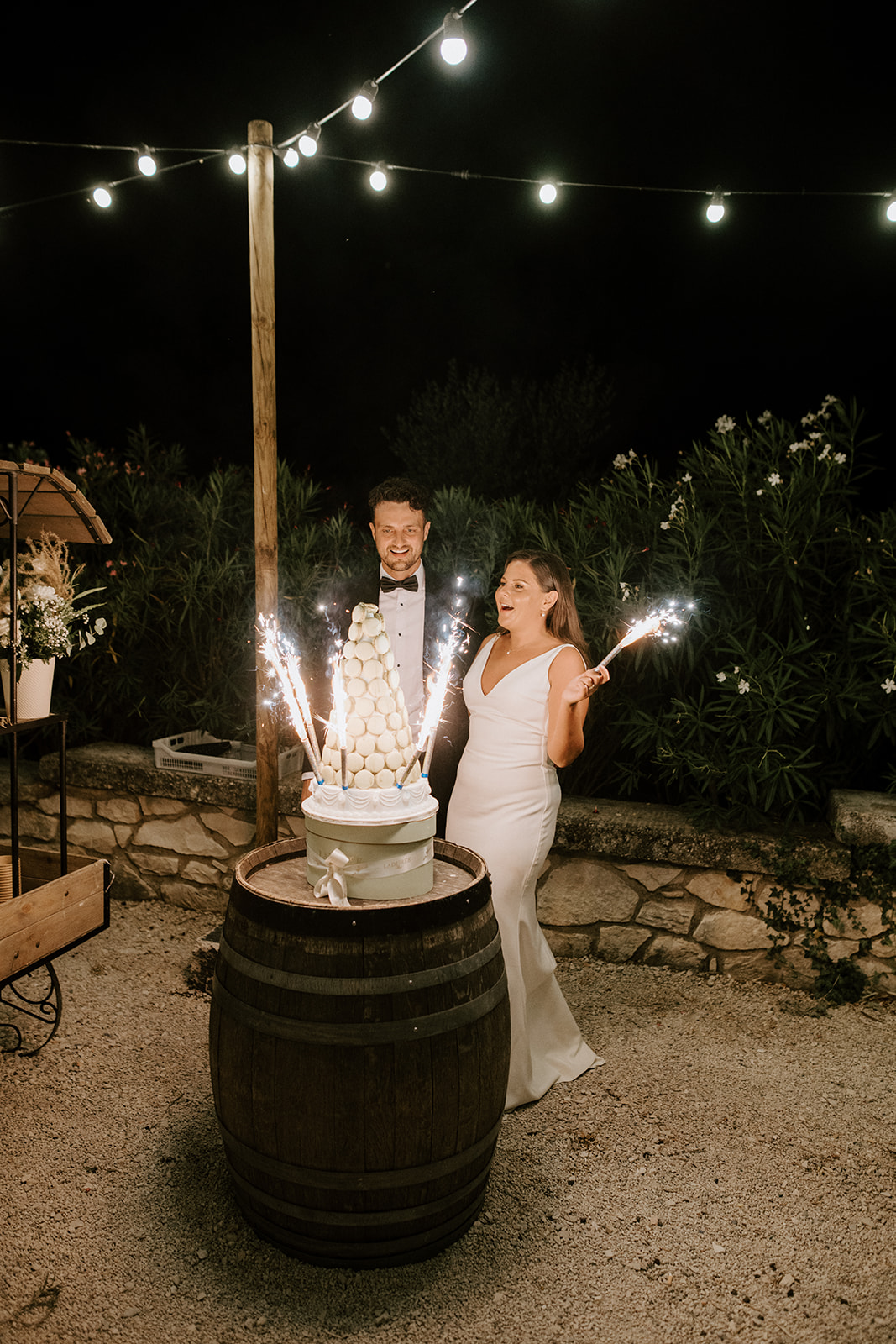 bride and groom holding sparklers during reception for provence wedding 