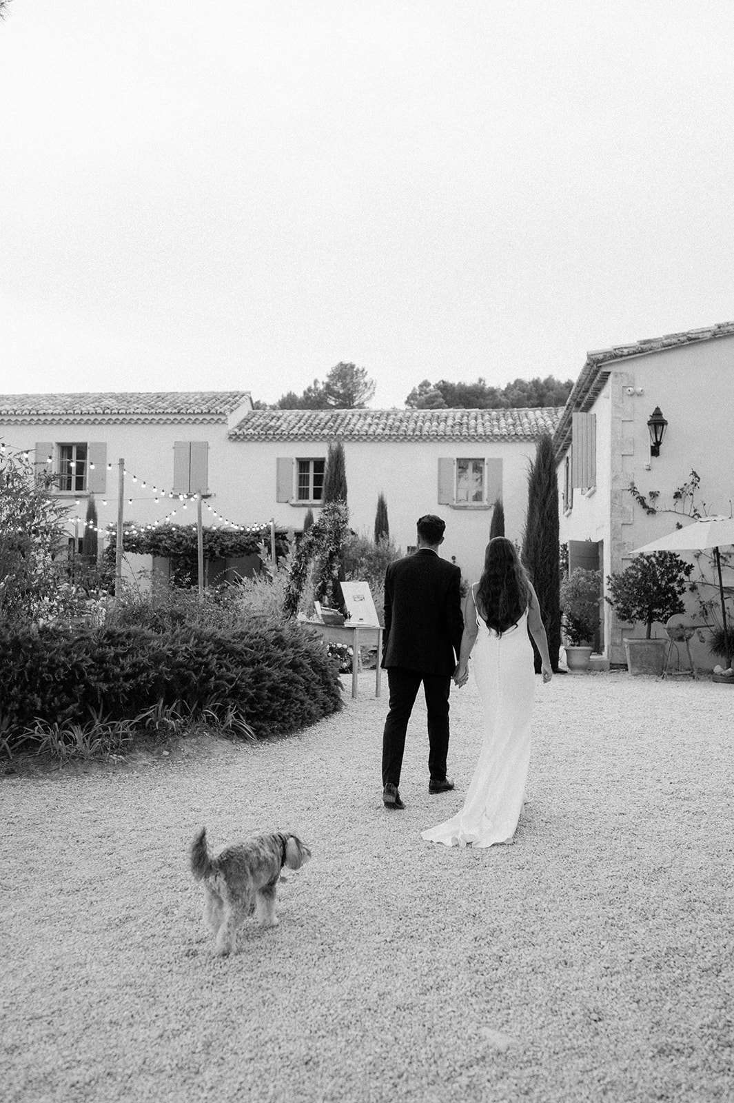 bride and groom walking towards reception at Le Mas Des Costes