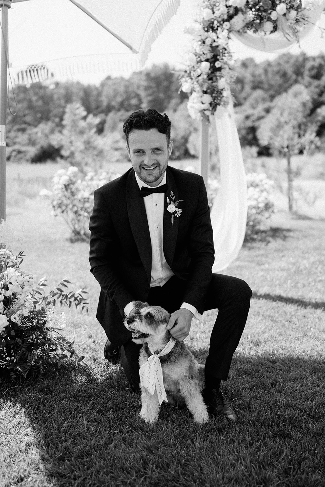 groom with dog at Le Mas Des Costes 