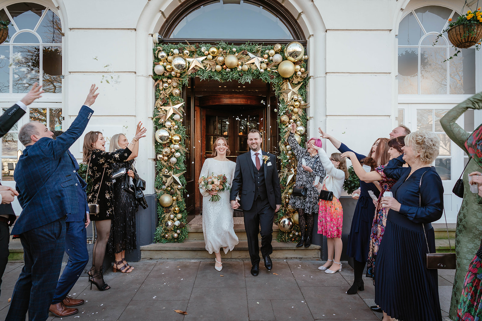 Zara Davis Wedding Photography Cotswolds Gloucestershire Cheltenham guests and couple confetti The Queens Hotel