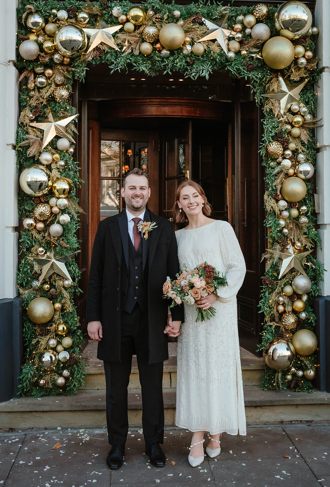 Zara Davis Wedding Photography Cotswolds Gloucestershire Cheltenham The Queens Hotel entrance Christmas Bride Groom