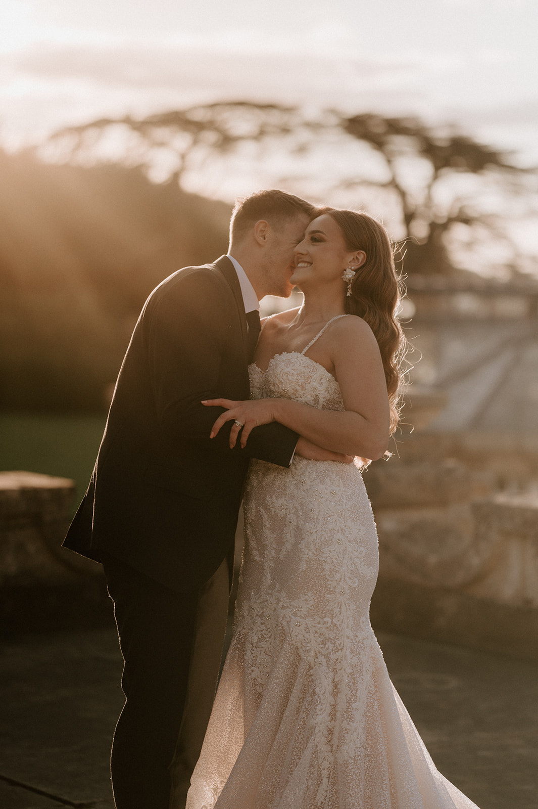 bride and groom at golden hour at harlaxton manor
