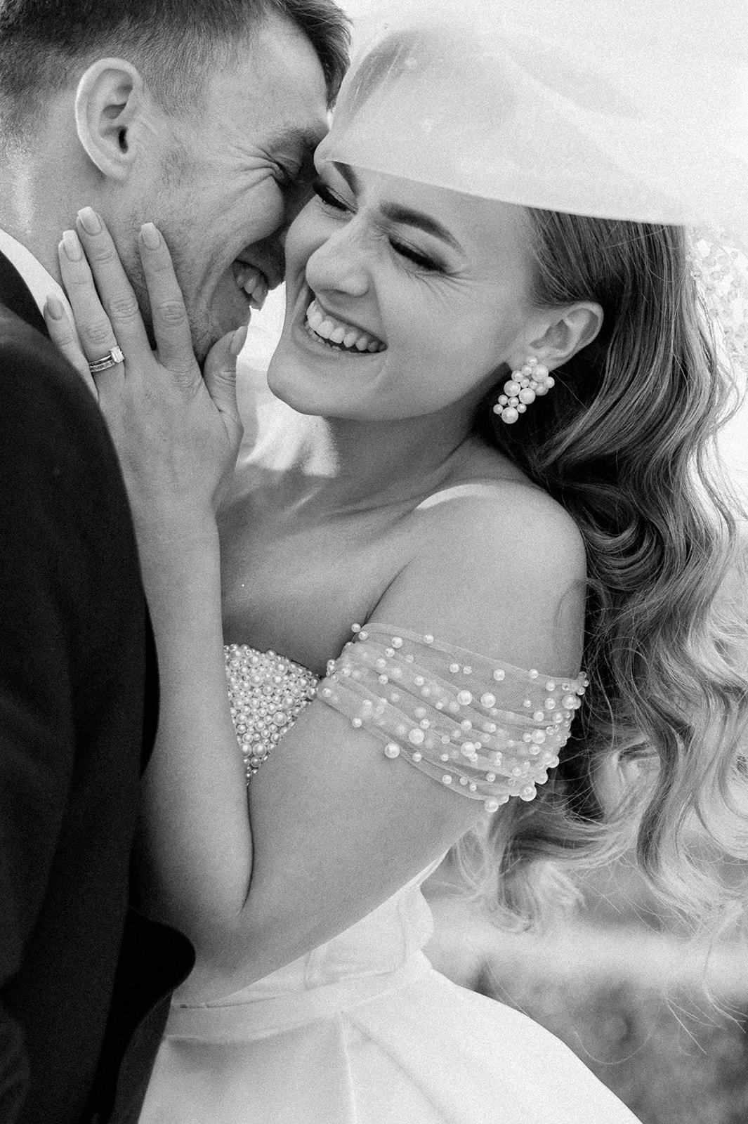 bride and groom laughing 