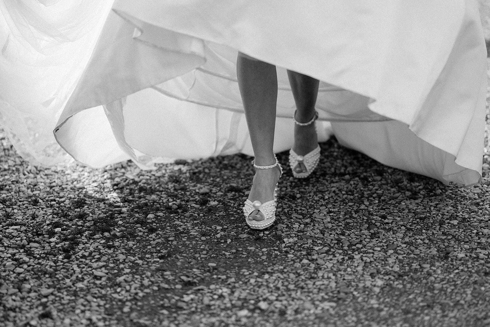 bride walking wearing jimmy choo shoes with pearls