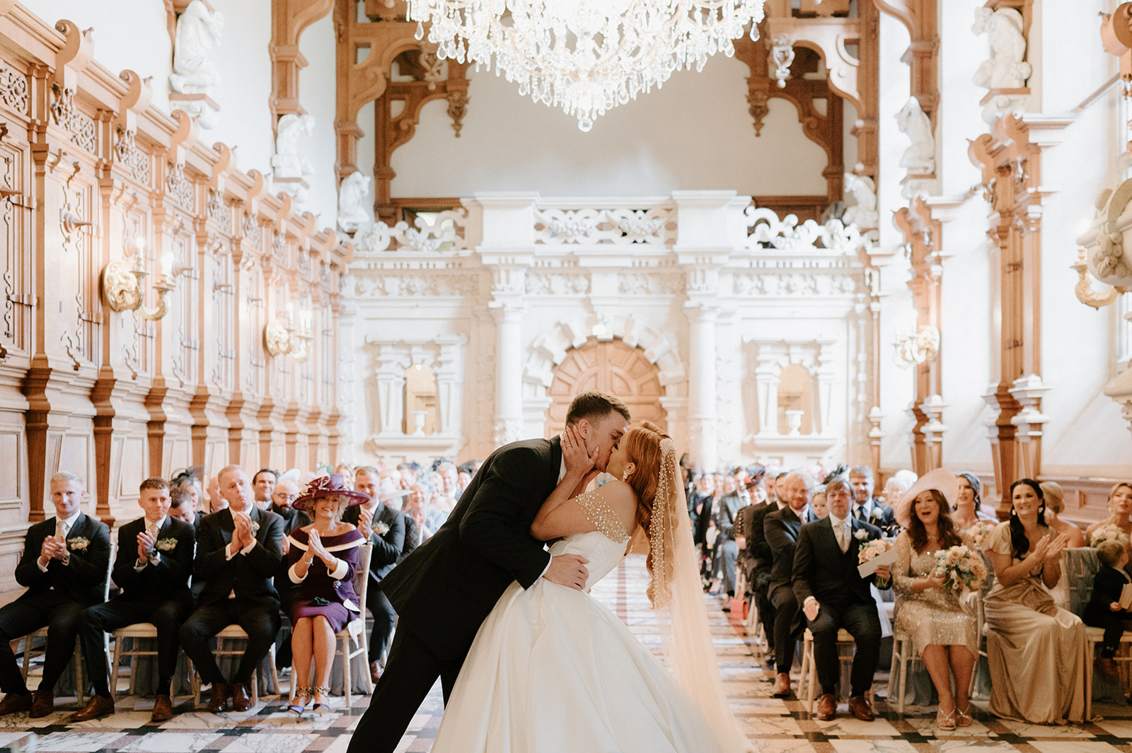 first kiss in ceremony in the great hall at harlaxton manor