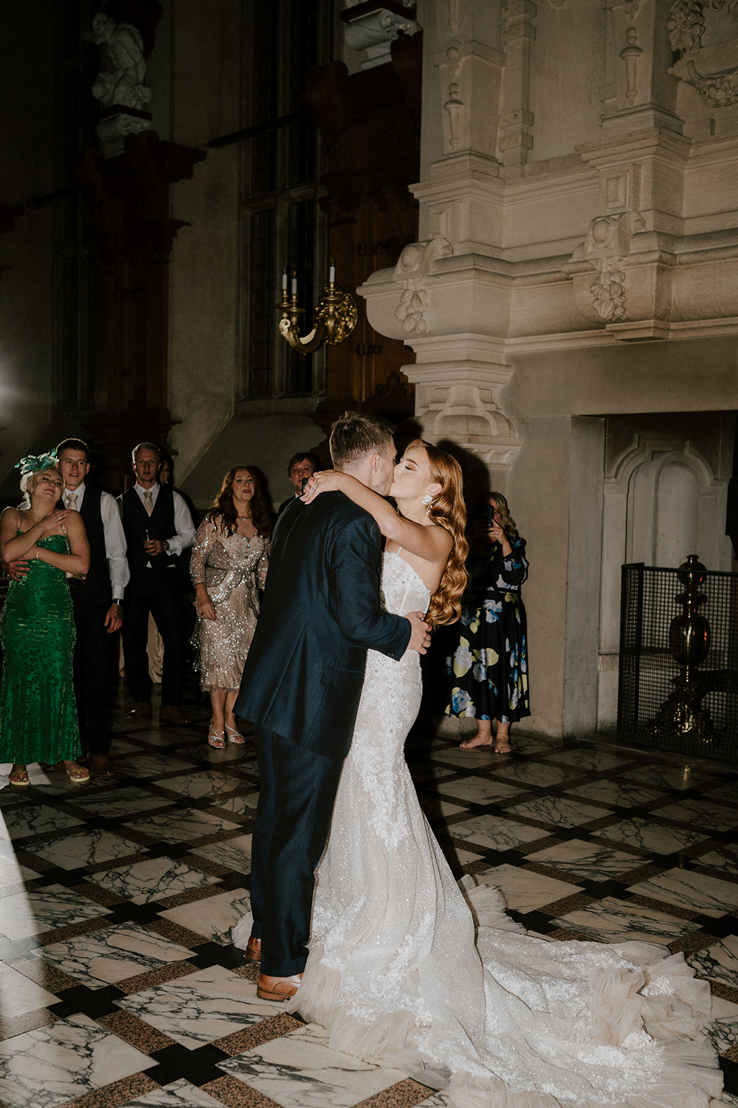 groom kissing bride during first dance at harlaxton manor