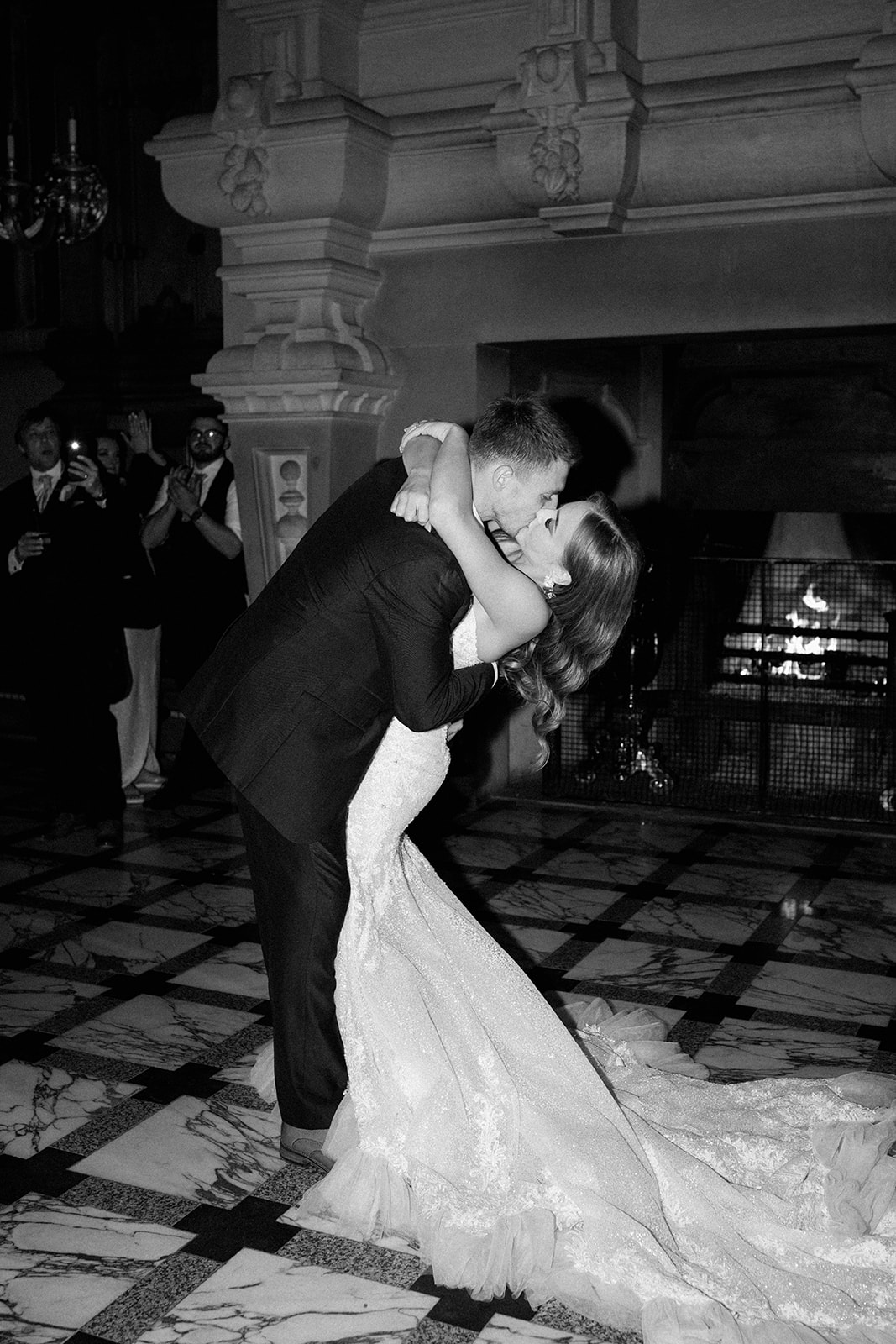 groom kissing bride during first dance at harlaxton manor
