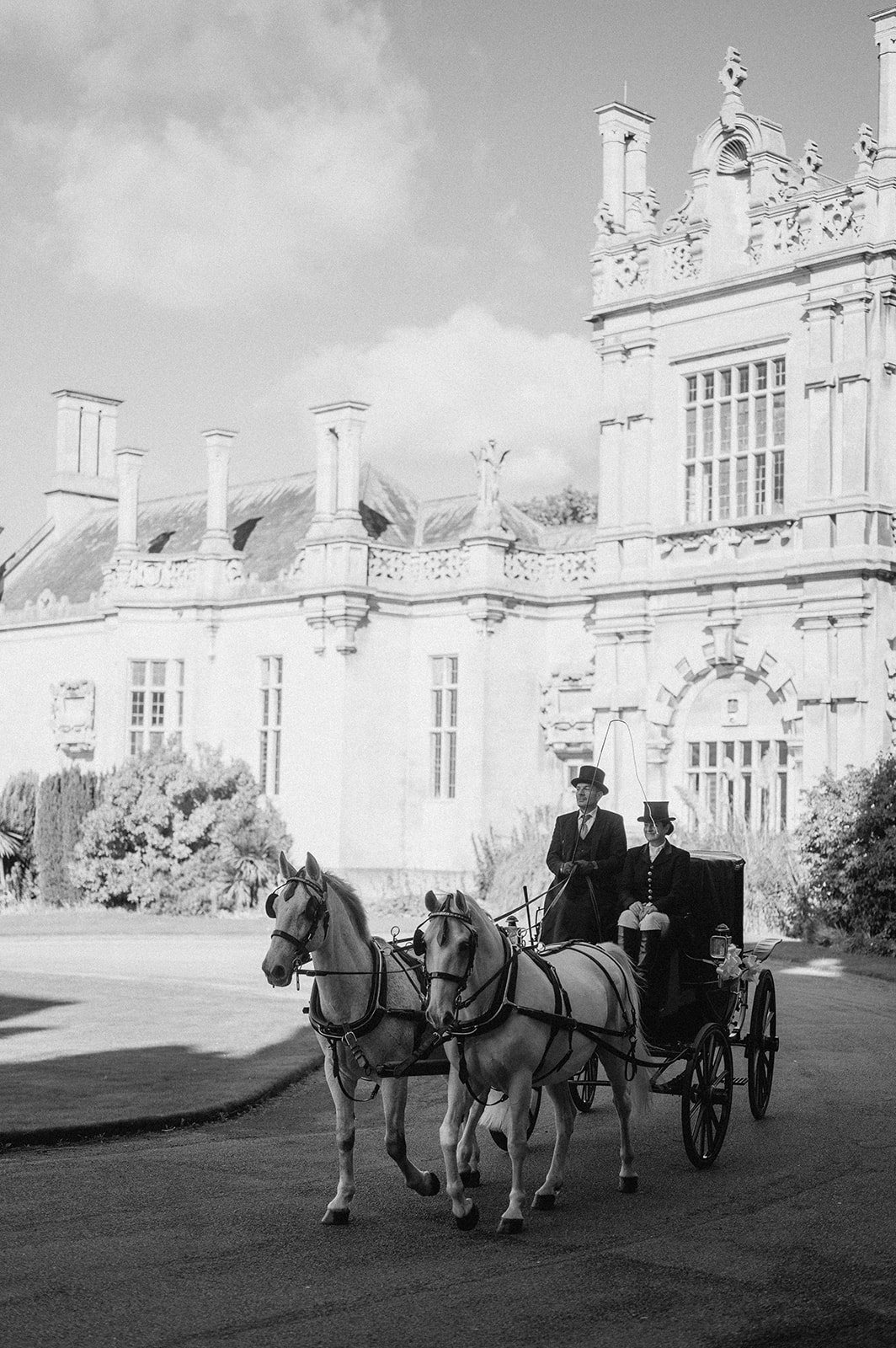 horse and carriage arriving at harlaxton manor