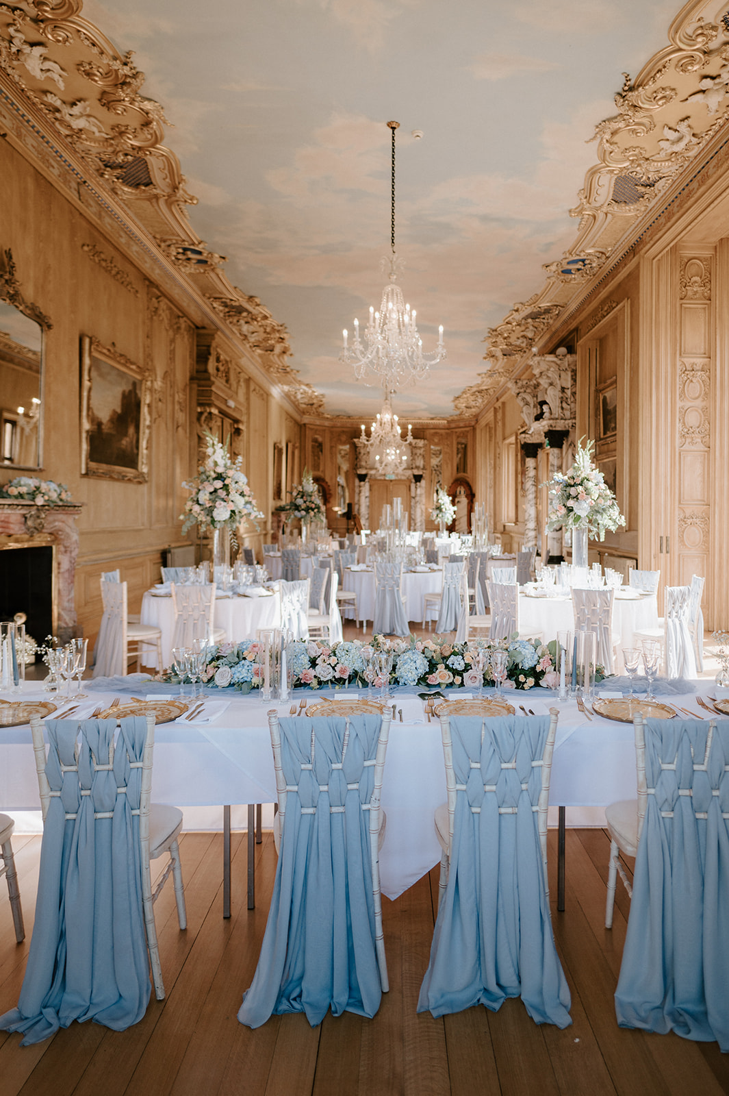 wedding breakfast set up in the long gallery at harlaxton manor