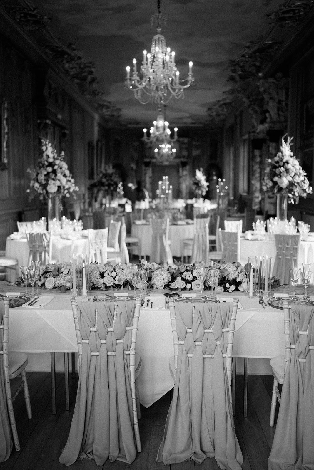 wedding breakfast set up in the long gallery at harlaxton manor