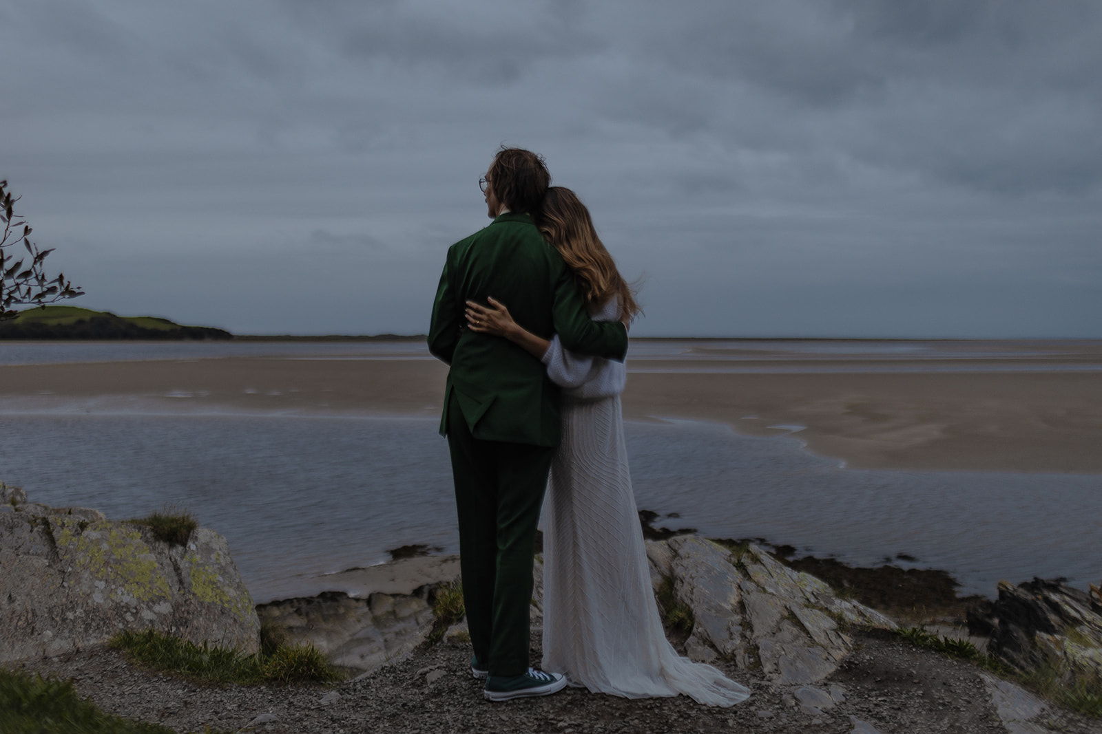 bride and groom blue hour photos by the sea at sunset at Frances quinn wedding in wales