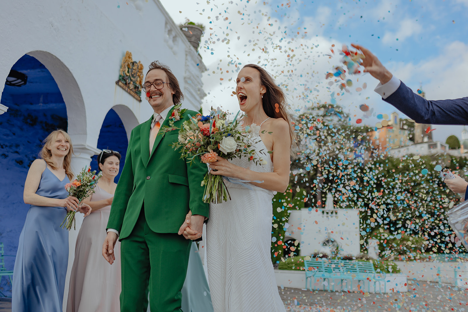 bride and groom with confetti at Frances quinn wedding in wales
