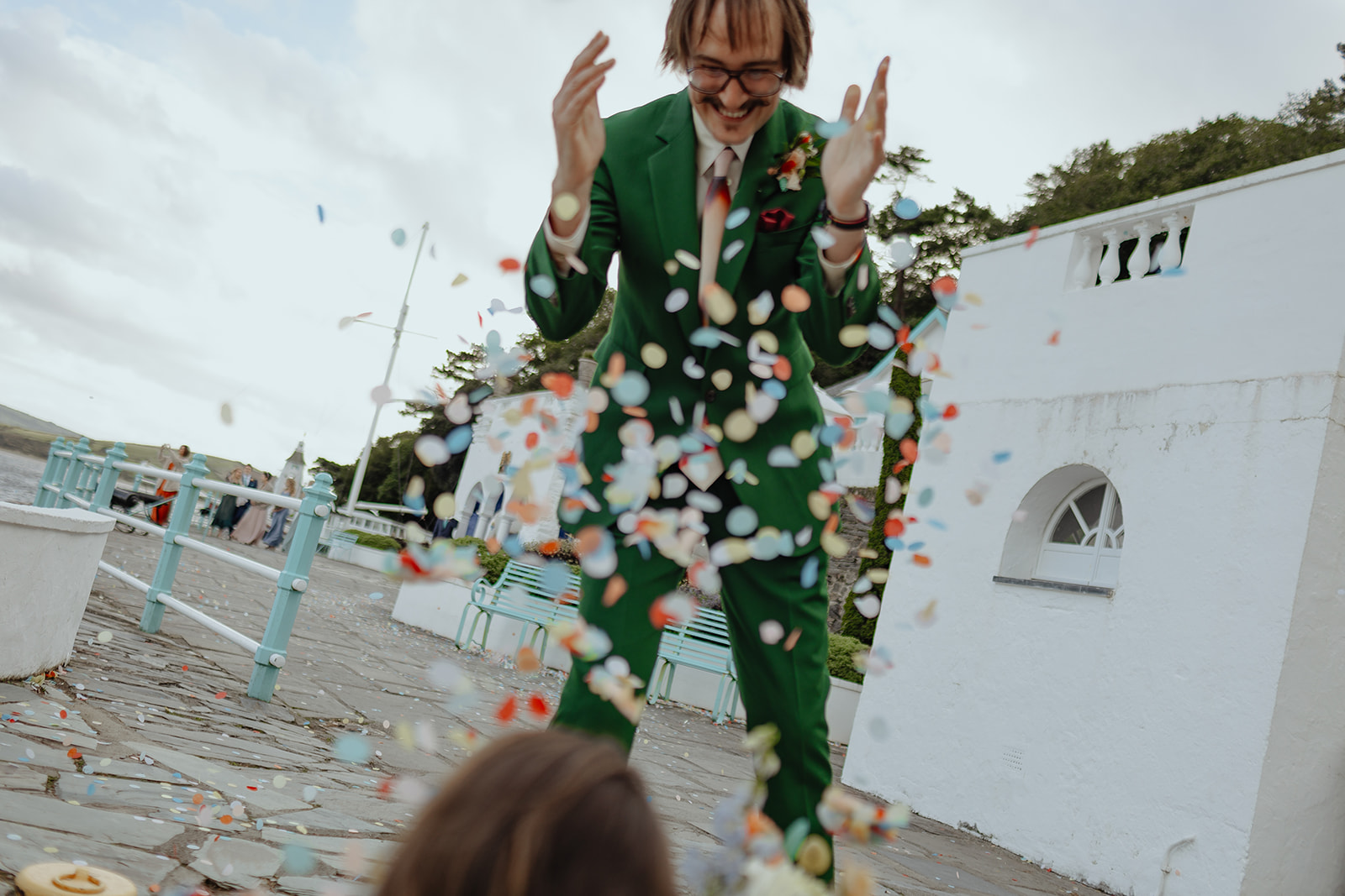 bride and groom with confetti at Frances quinn wedding in wales