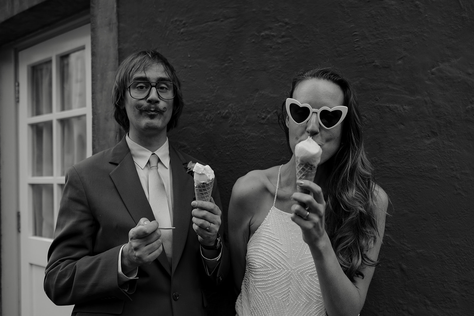 bride and groom eating icecreams at Frances quinn wedding in wales