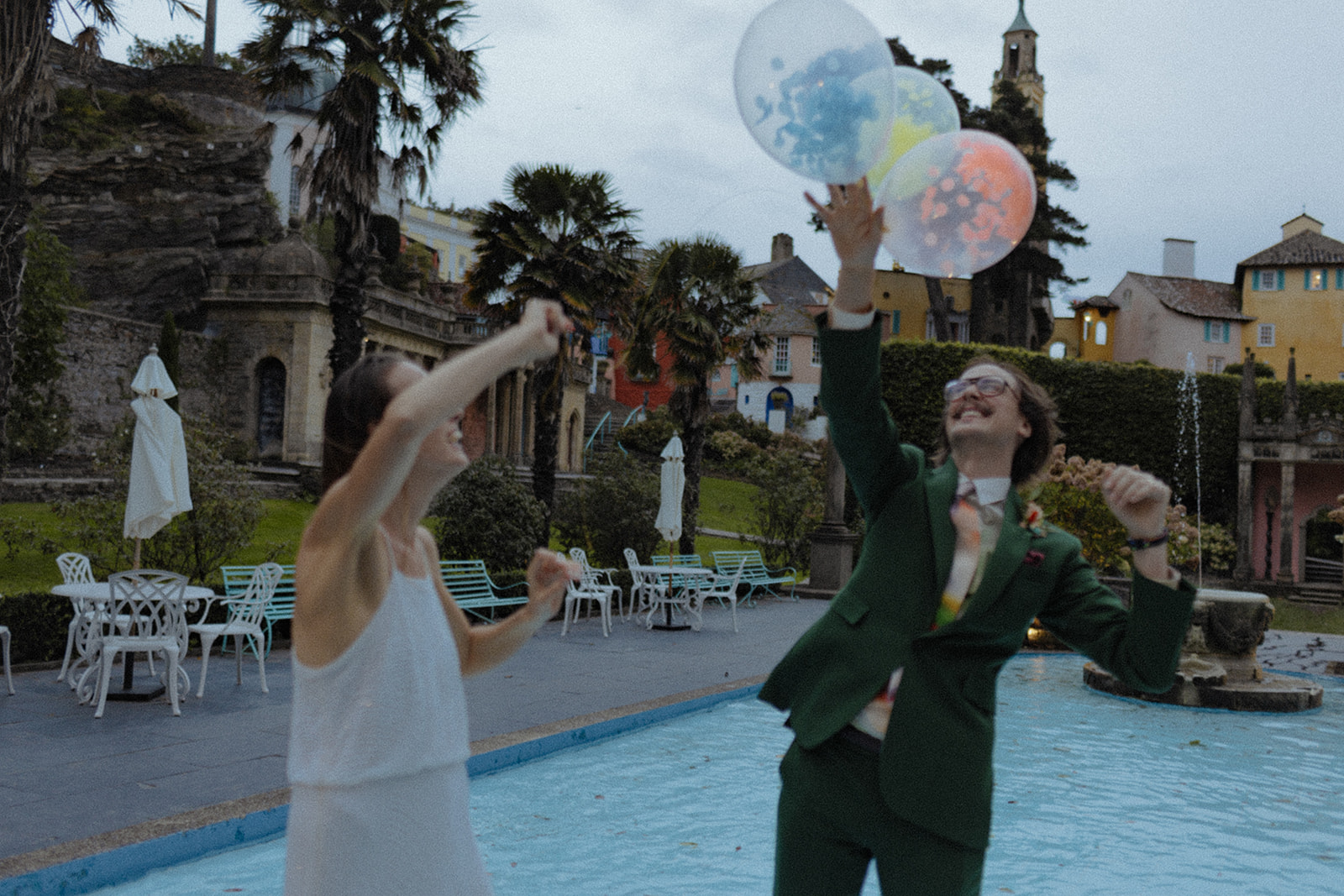 bride and groom playing with balloons at Frances quinn wedding in wales