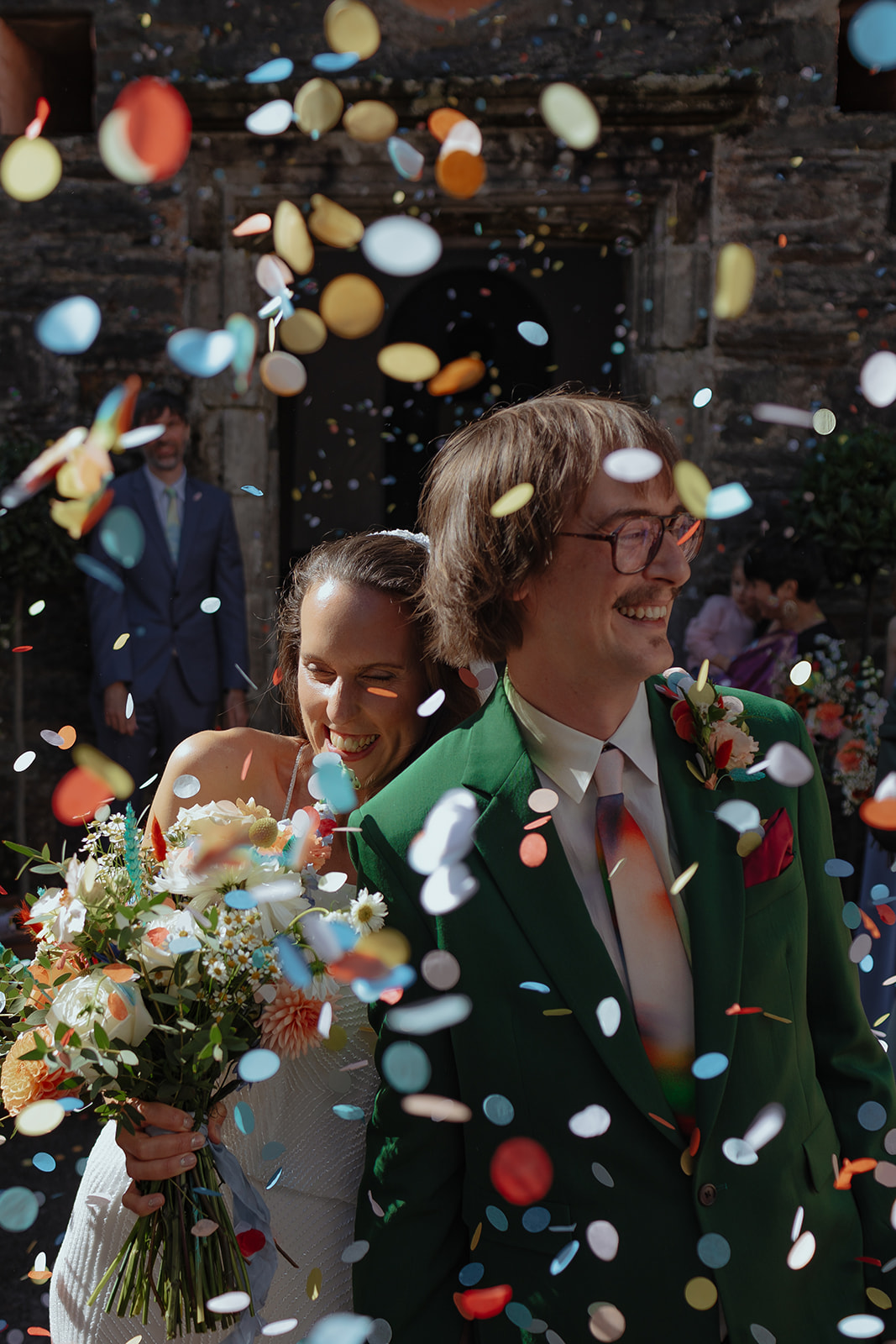 Frances quinn and groom with flutterdarlings confetti photos in portmeirion wedding 