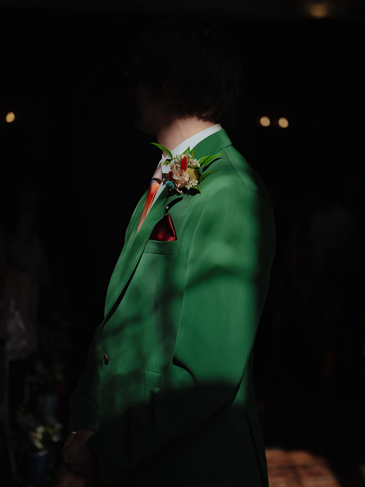 Groom in his green paul smith suit jacket
