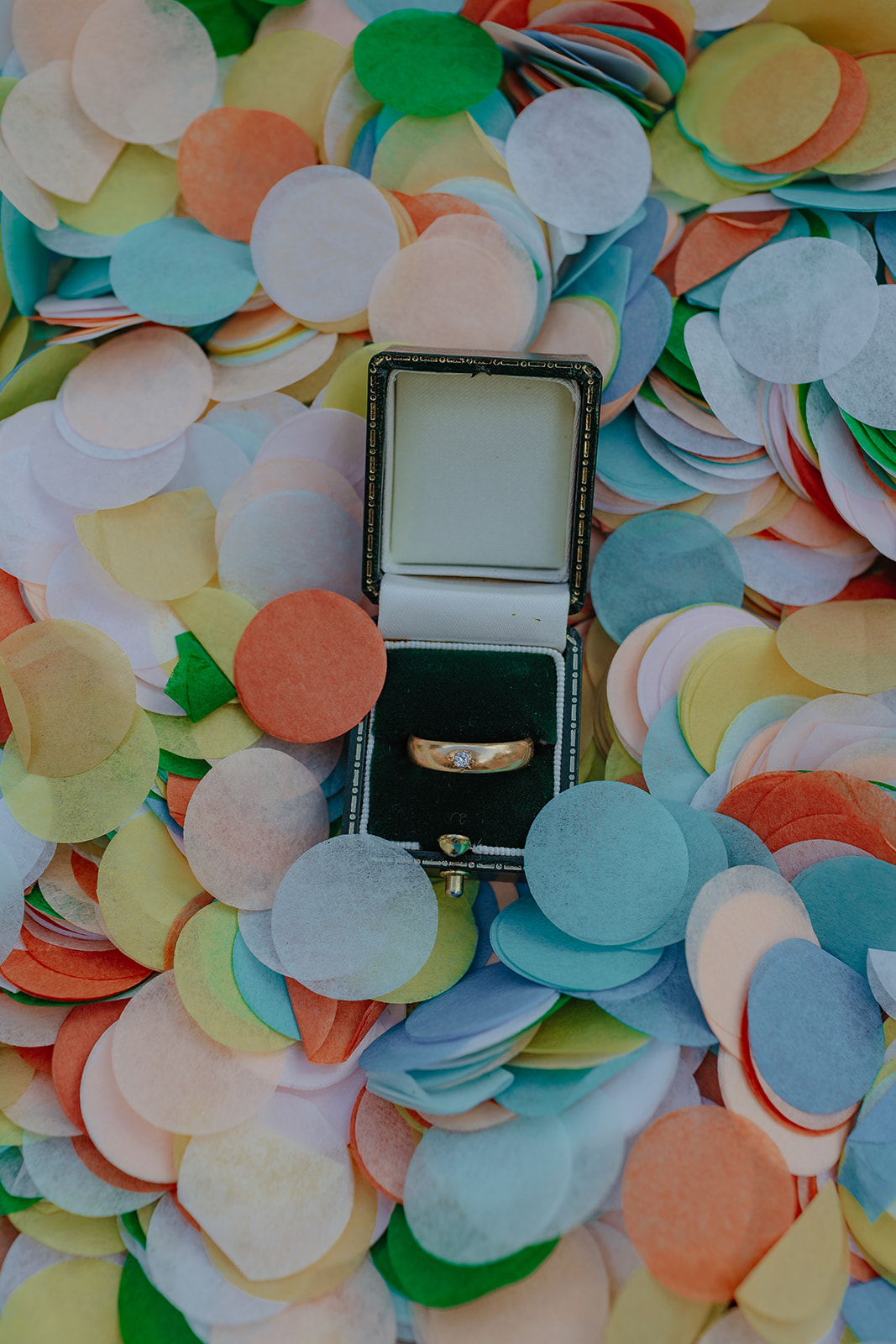 wedding ring on bed of confetti by flutterdarlings