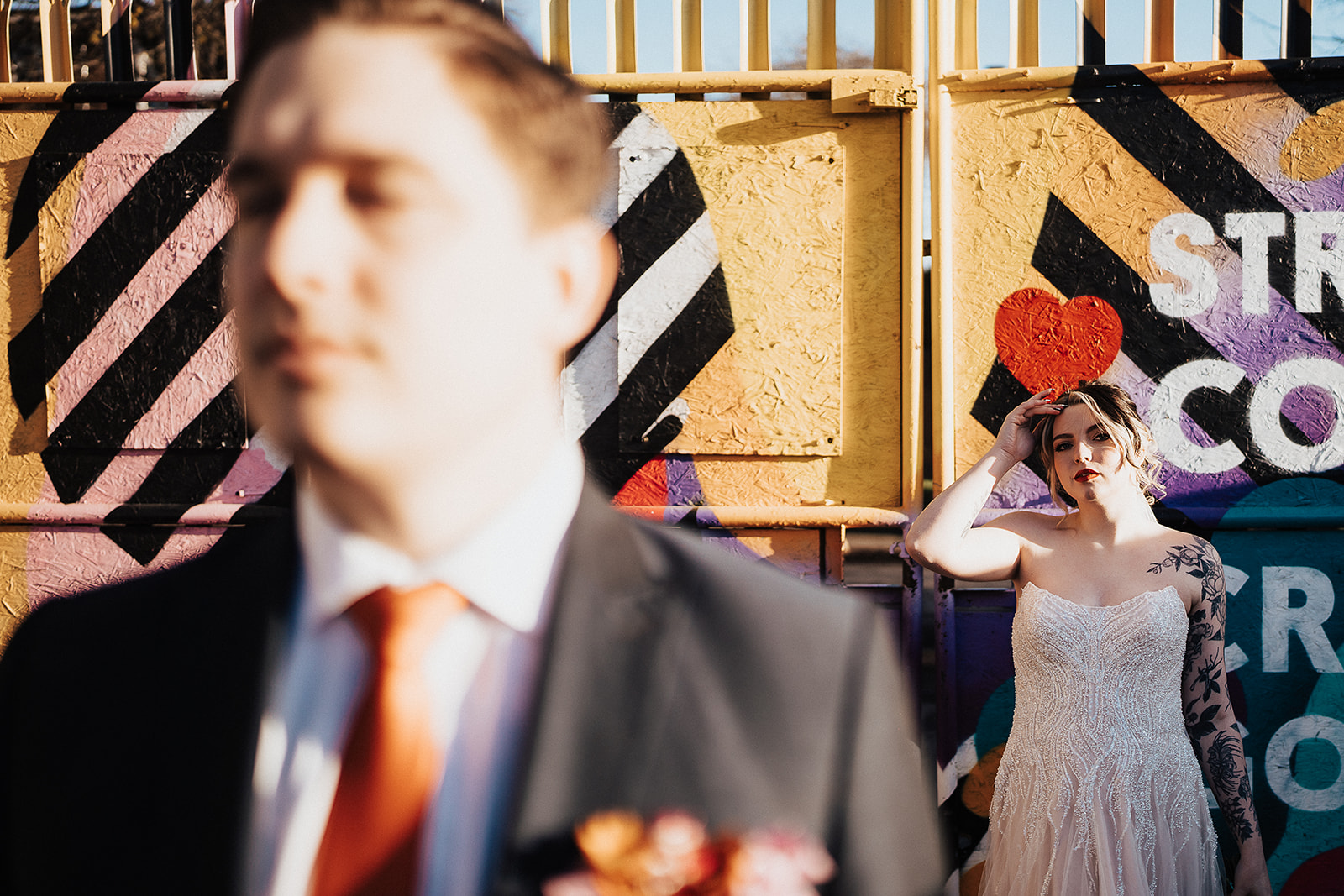 couple against colourful background  | The Chocolate Factory Wedding Derby