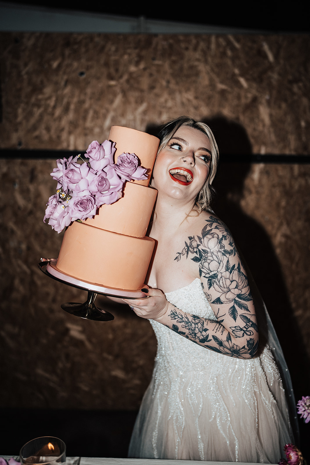 bride hold cake  | Chocolate Factory Wedding Derby