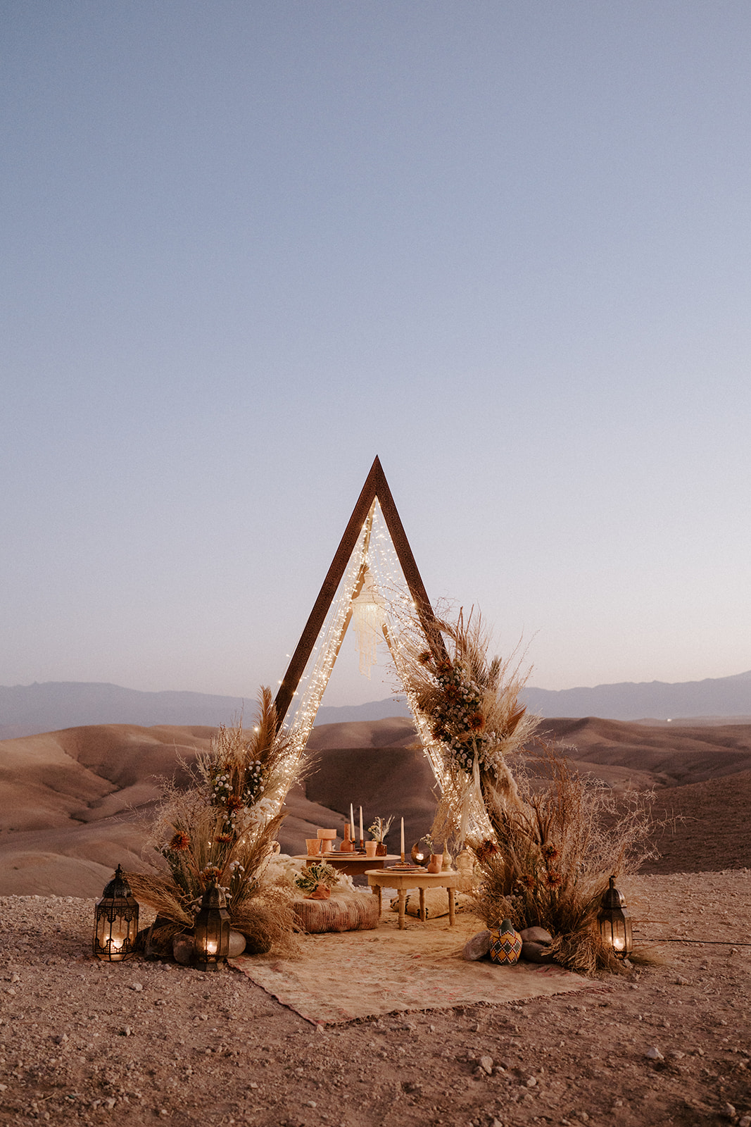 triangle arch ceremony set up in agafay desert