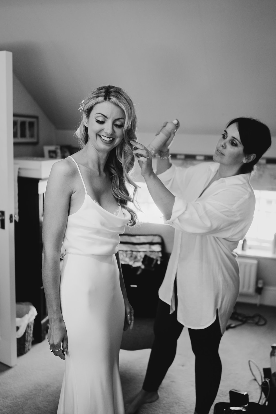 The bride having her hair styled