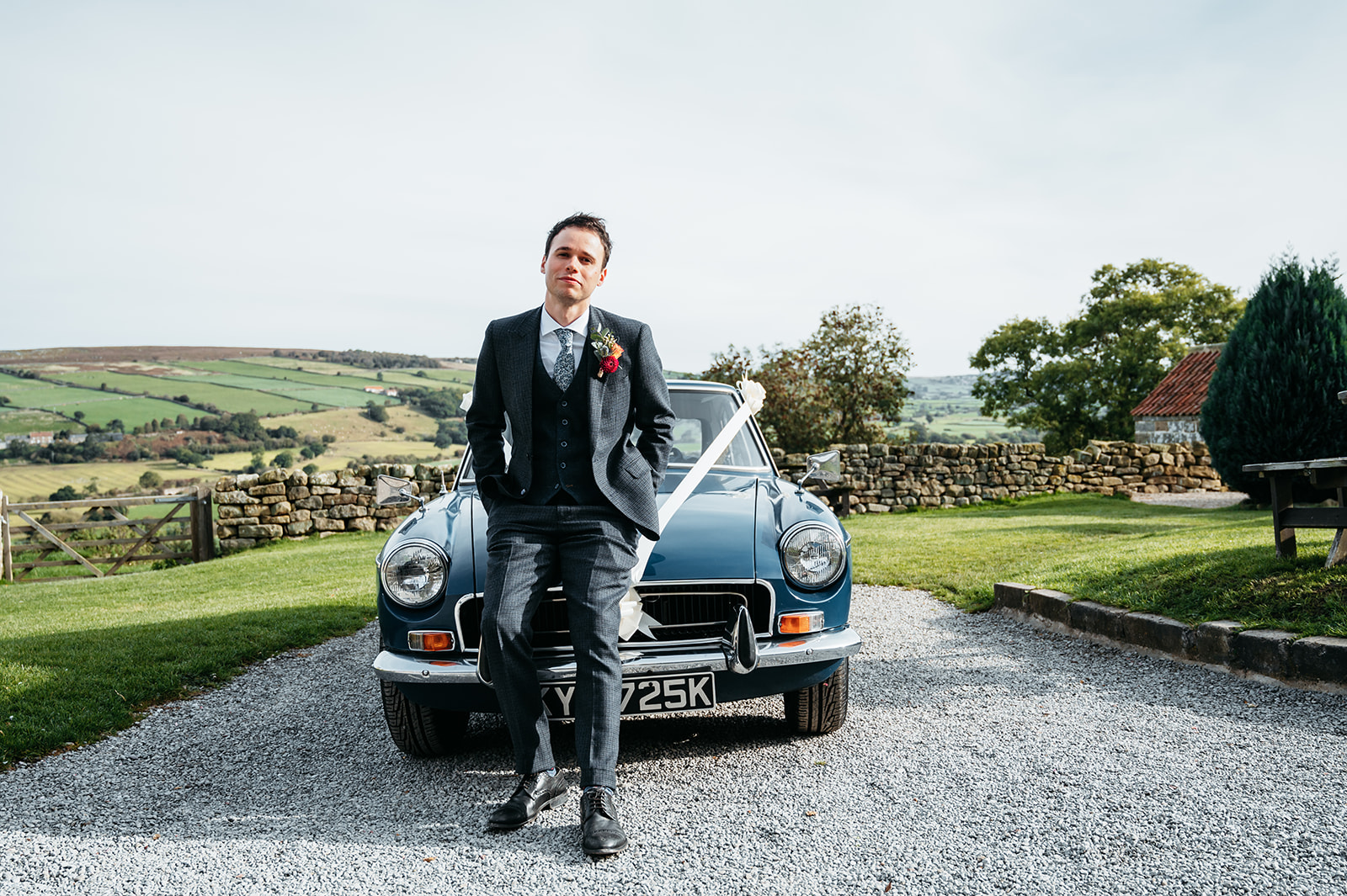 Ric standing in front of his wedding car
