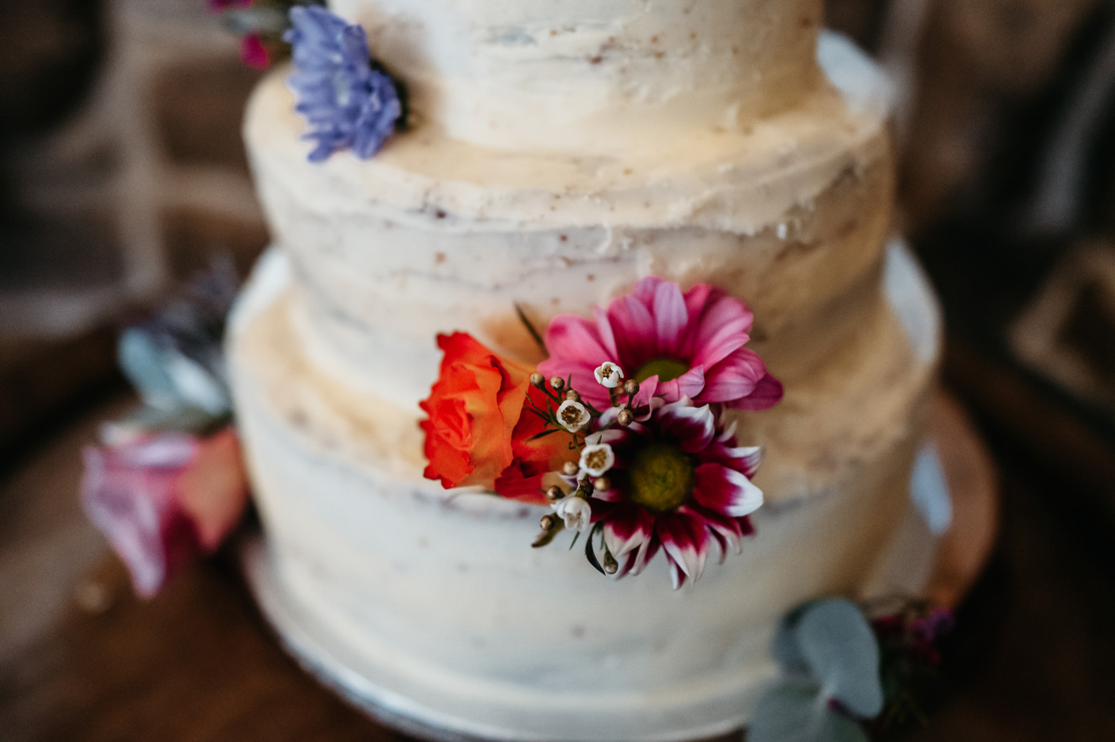 A beautifully crafted wedding cake with intricate icing designs