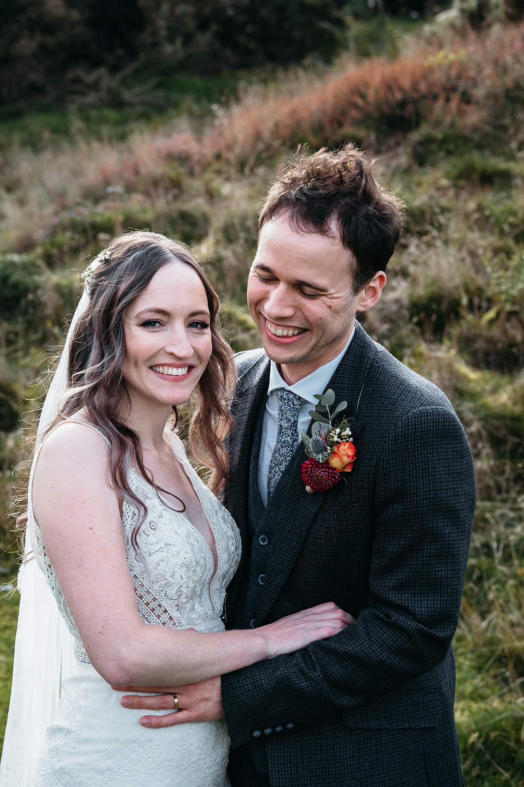 Romantic portrait of Adelle and Ric, the bride and groom, sharing a tender moment together in Danby Castle
