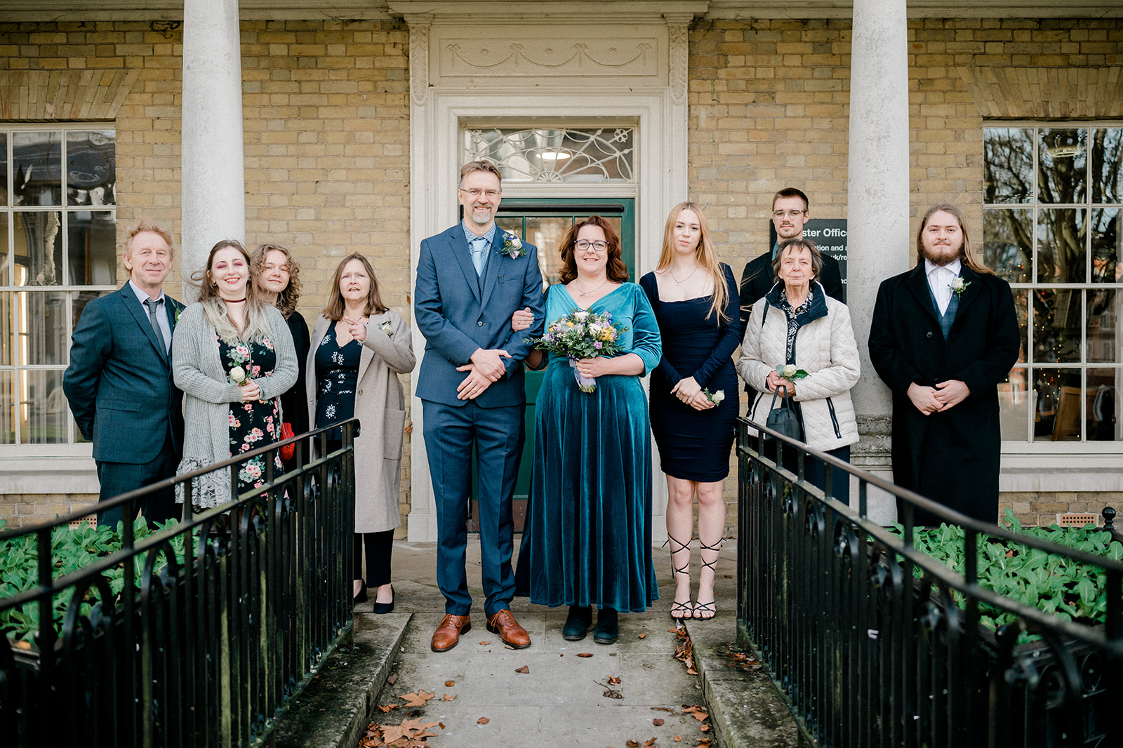 Outdoor photo of married couple and wedding guests Basingstoke Registry Office.