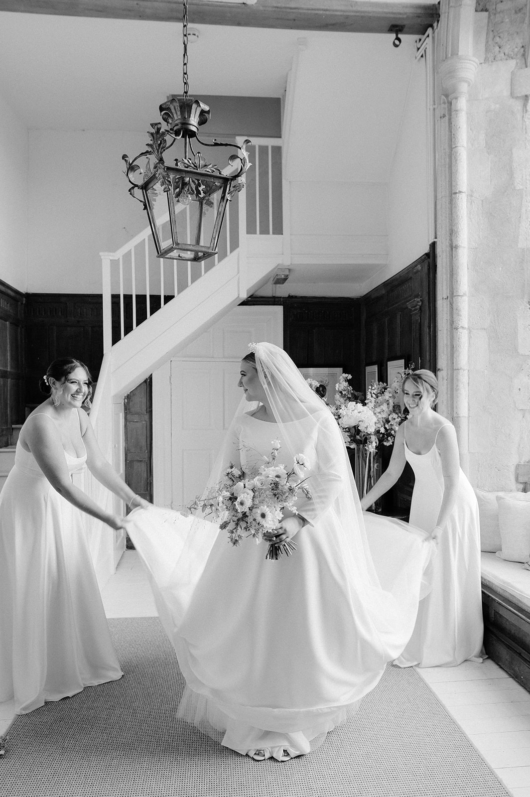 bride and bridesmaids wearing white dresses at butley priory