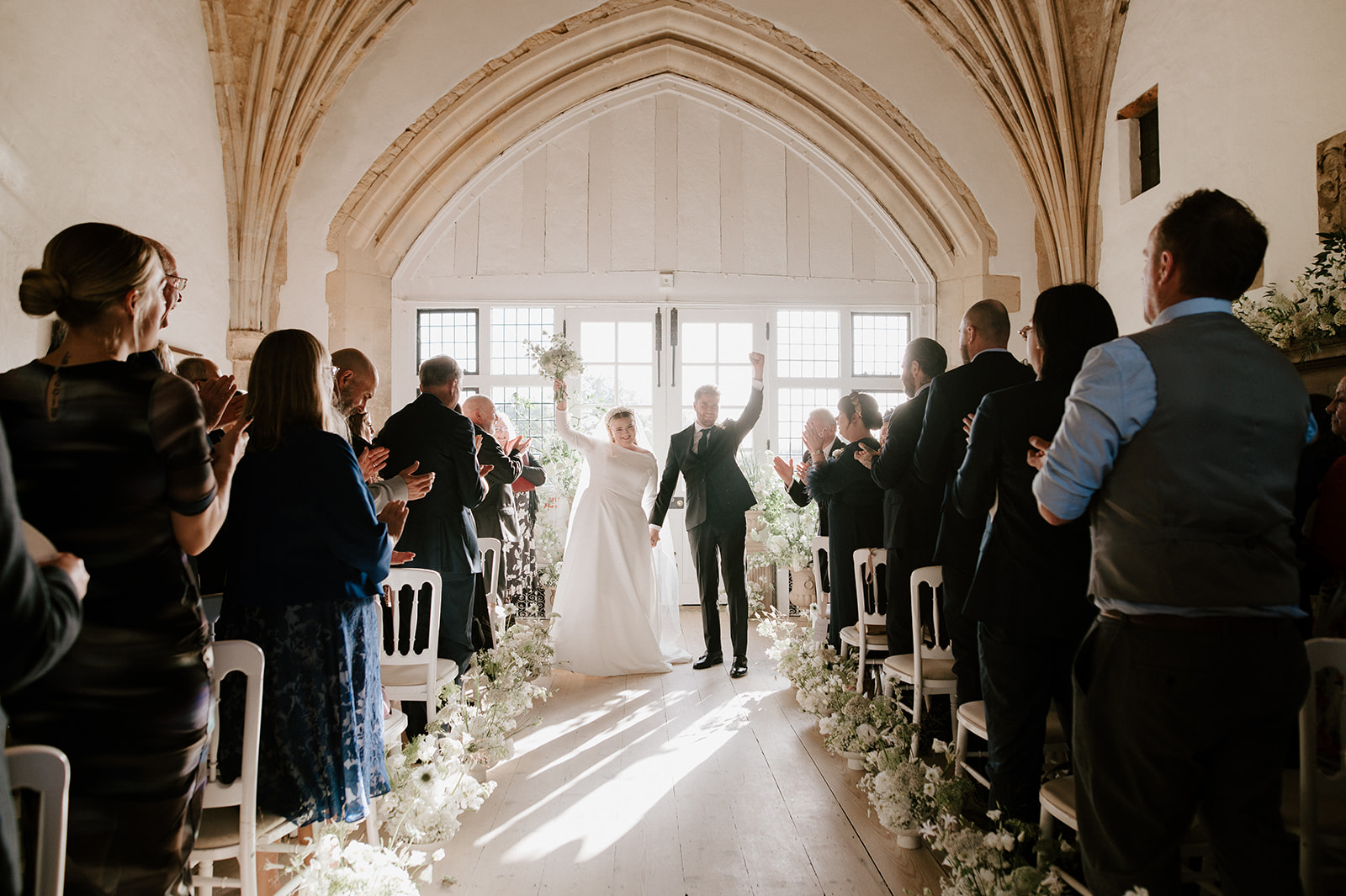 bride and groom ceremony in great hall at butley priory