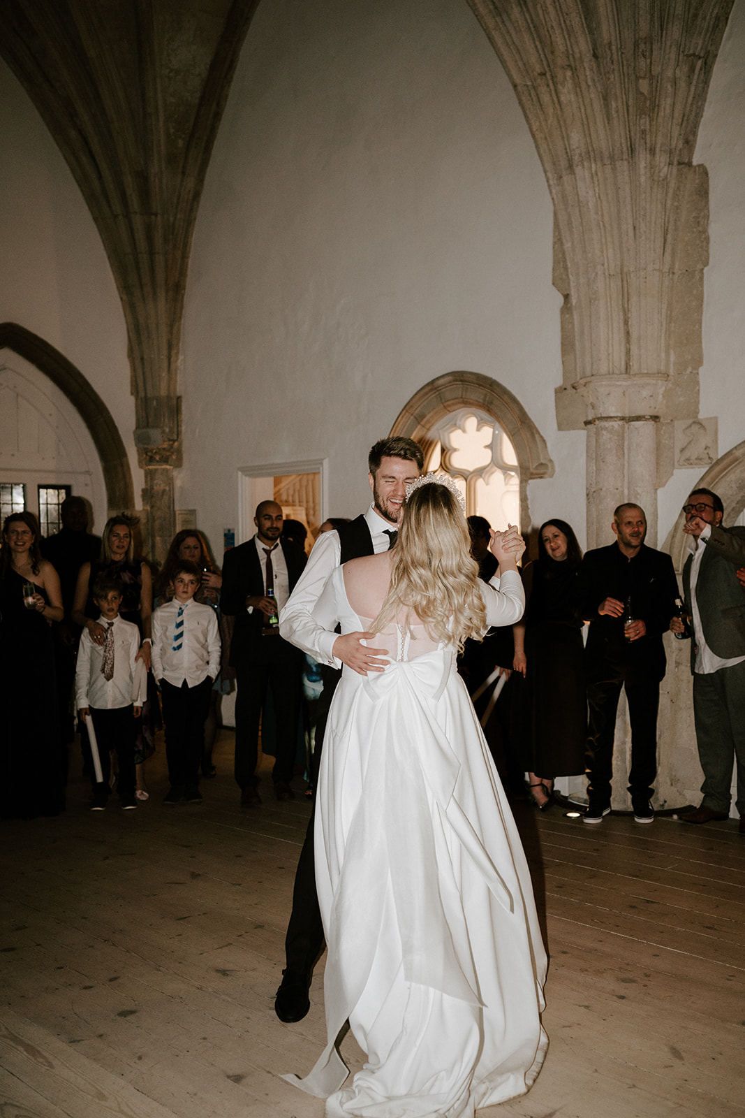 bride and groom doing first dance in great hall at butley priory