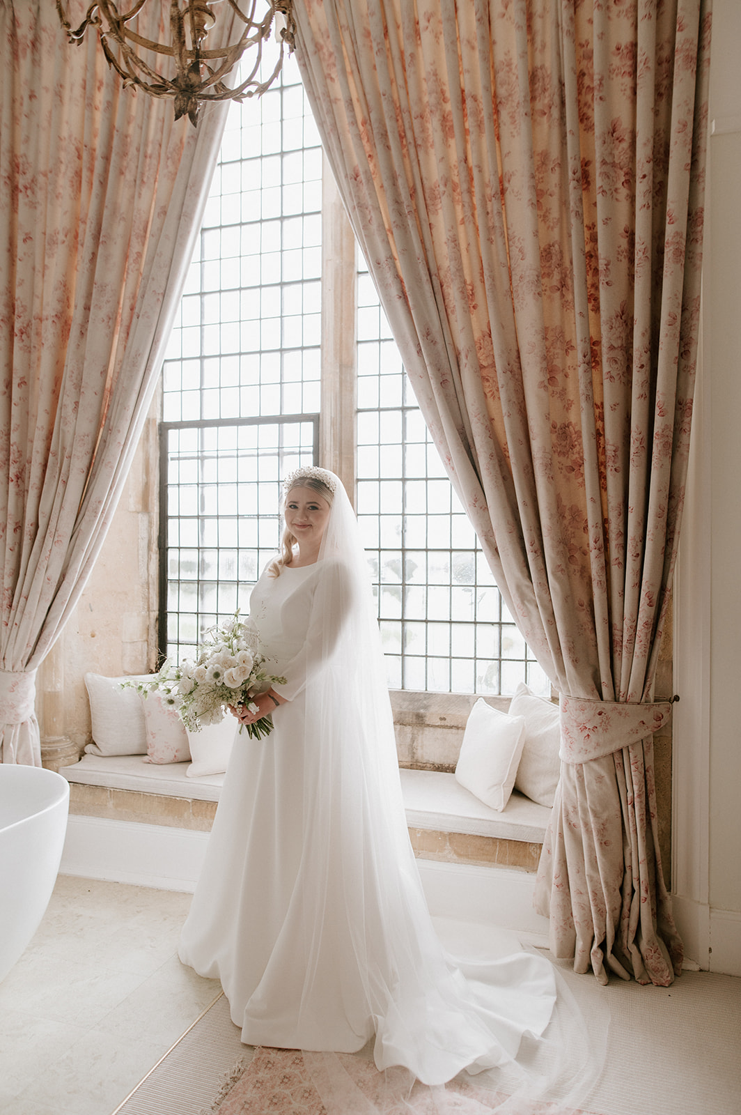brides with bouquet in bridal suite at butley priory