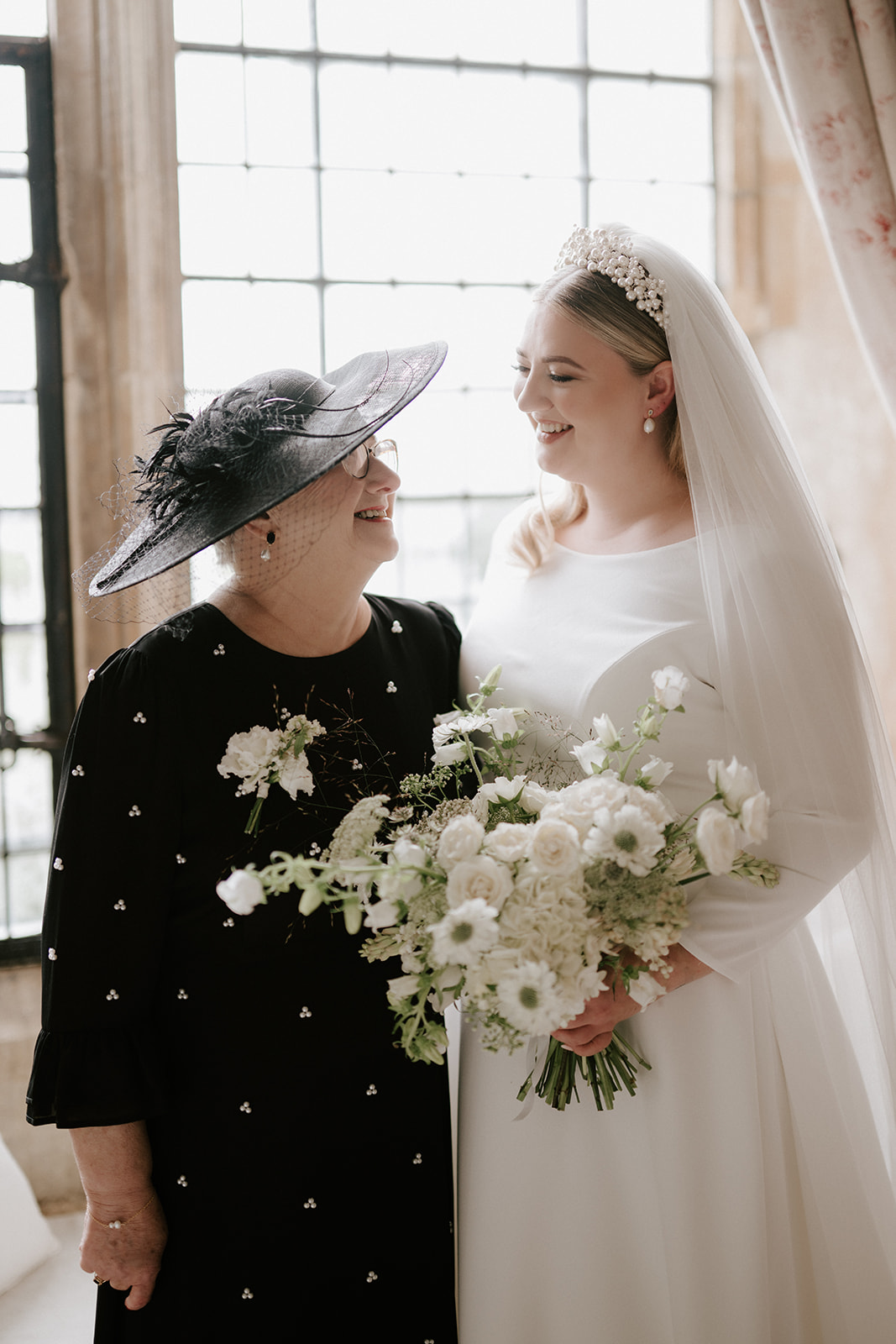 brides with bouquet and mother in bridal suite at butley priory