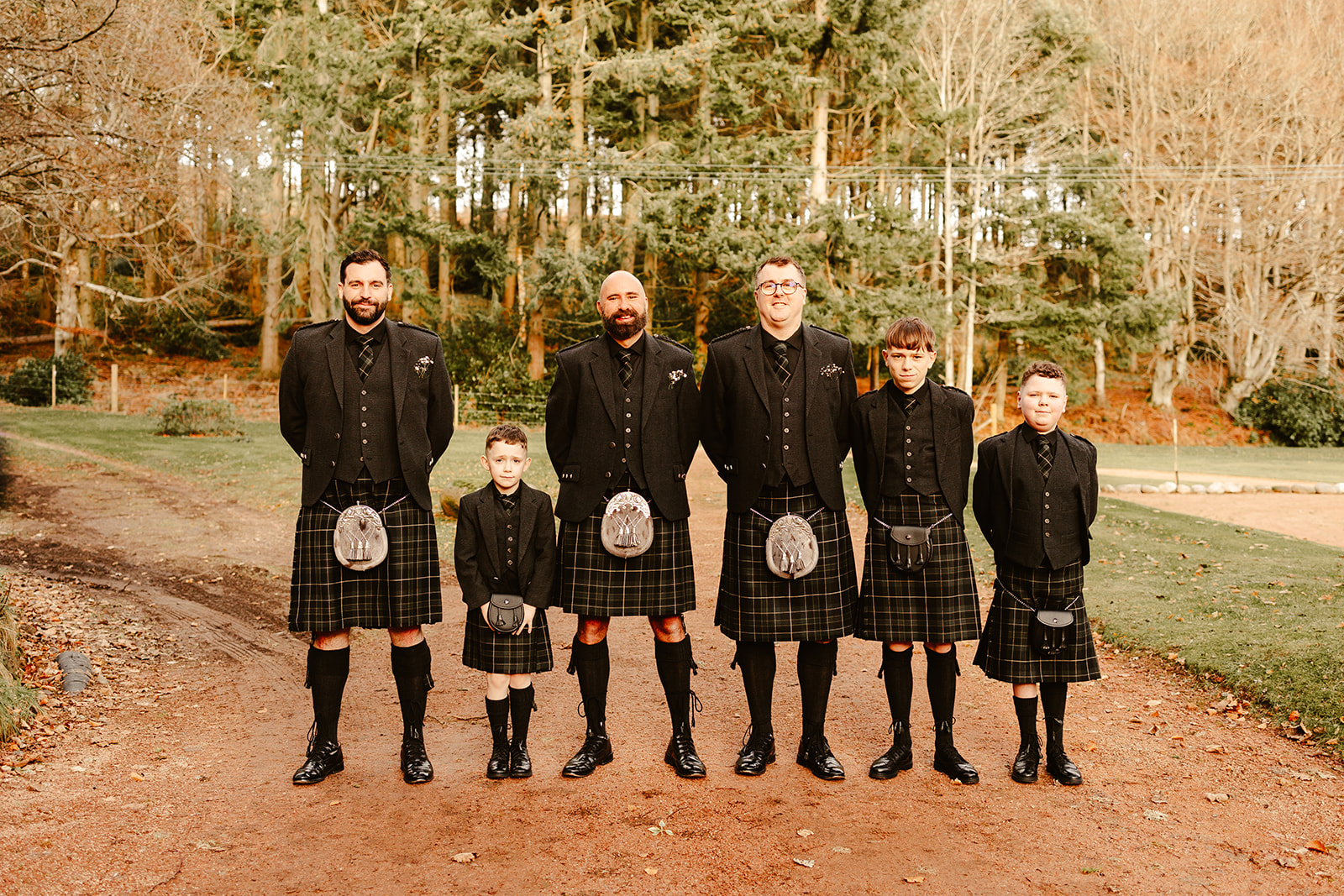 groom with groomsmen pose for a photo