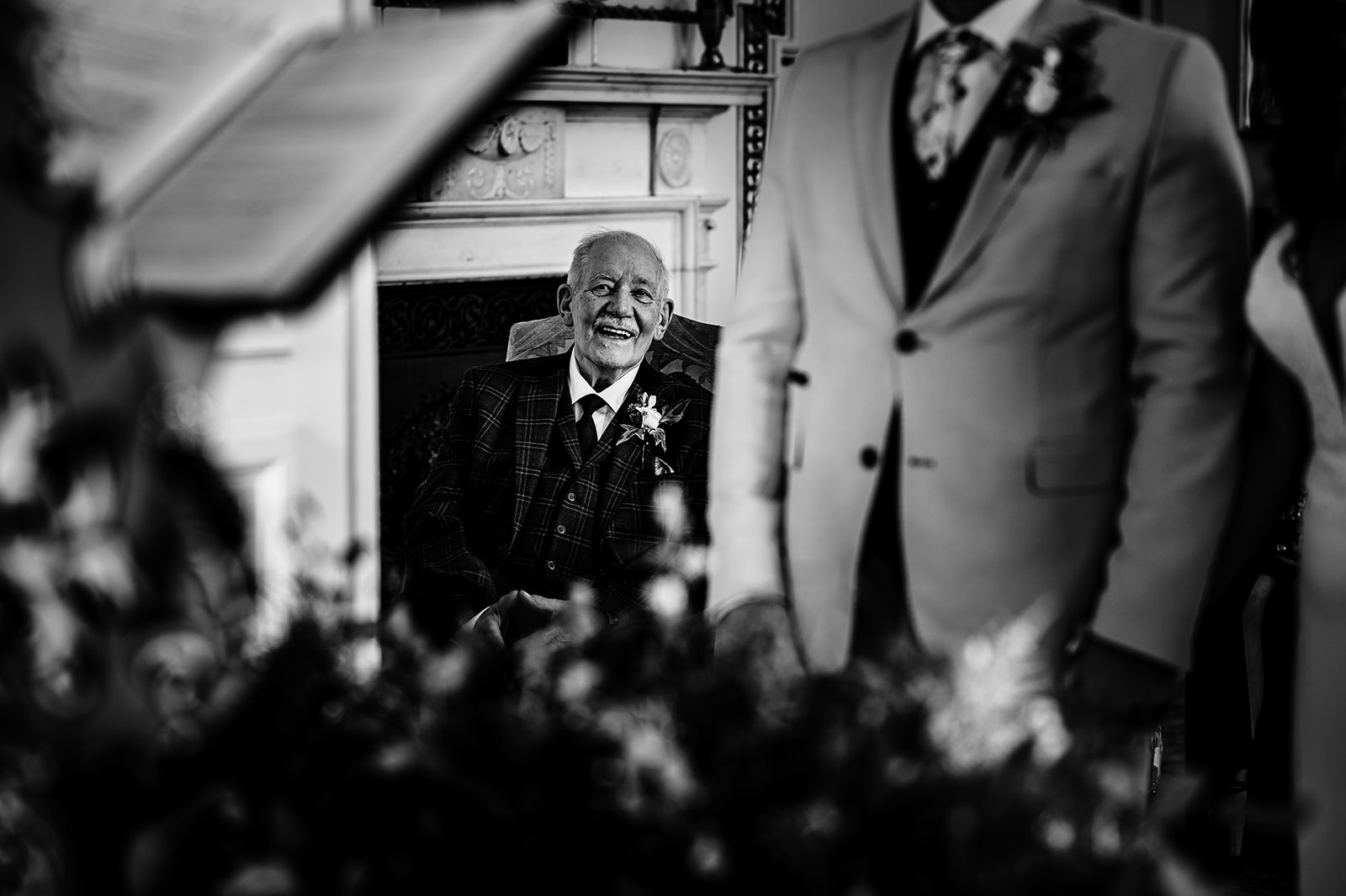 Dad looking at his son and smiling during in intimate wedding ceremony at Stapleford Park hotel Amanda Forman Photograph