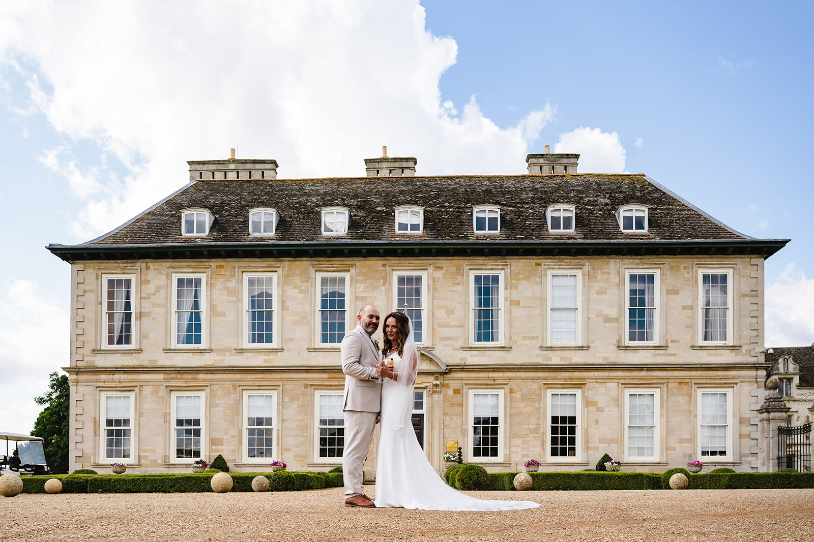 Bride and groom wedding portrait at the front of Stapleford Park hotel by Amanda Forman Photography