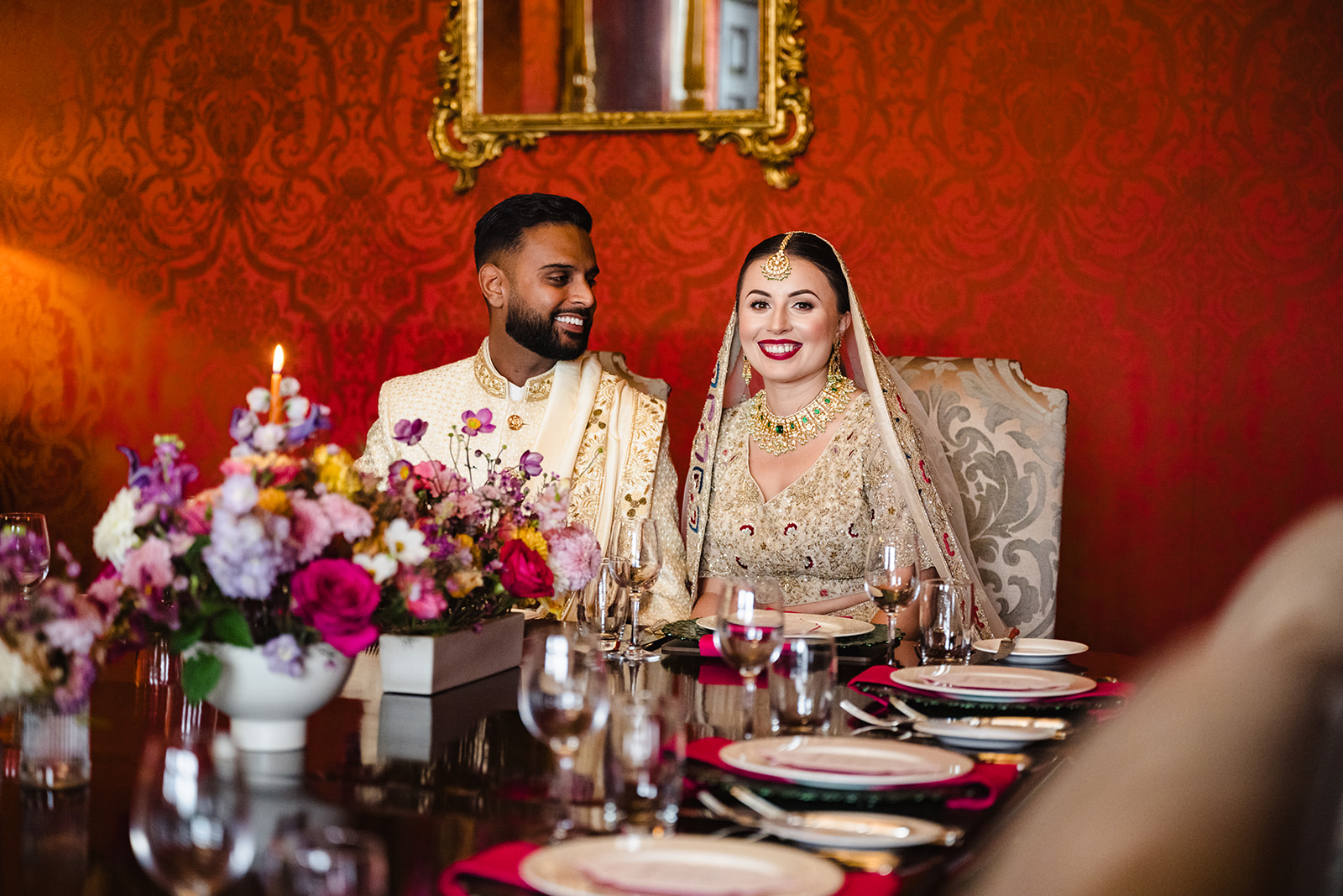 Couple seated at their wedding table by Amanda Forman Photography