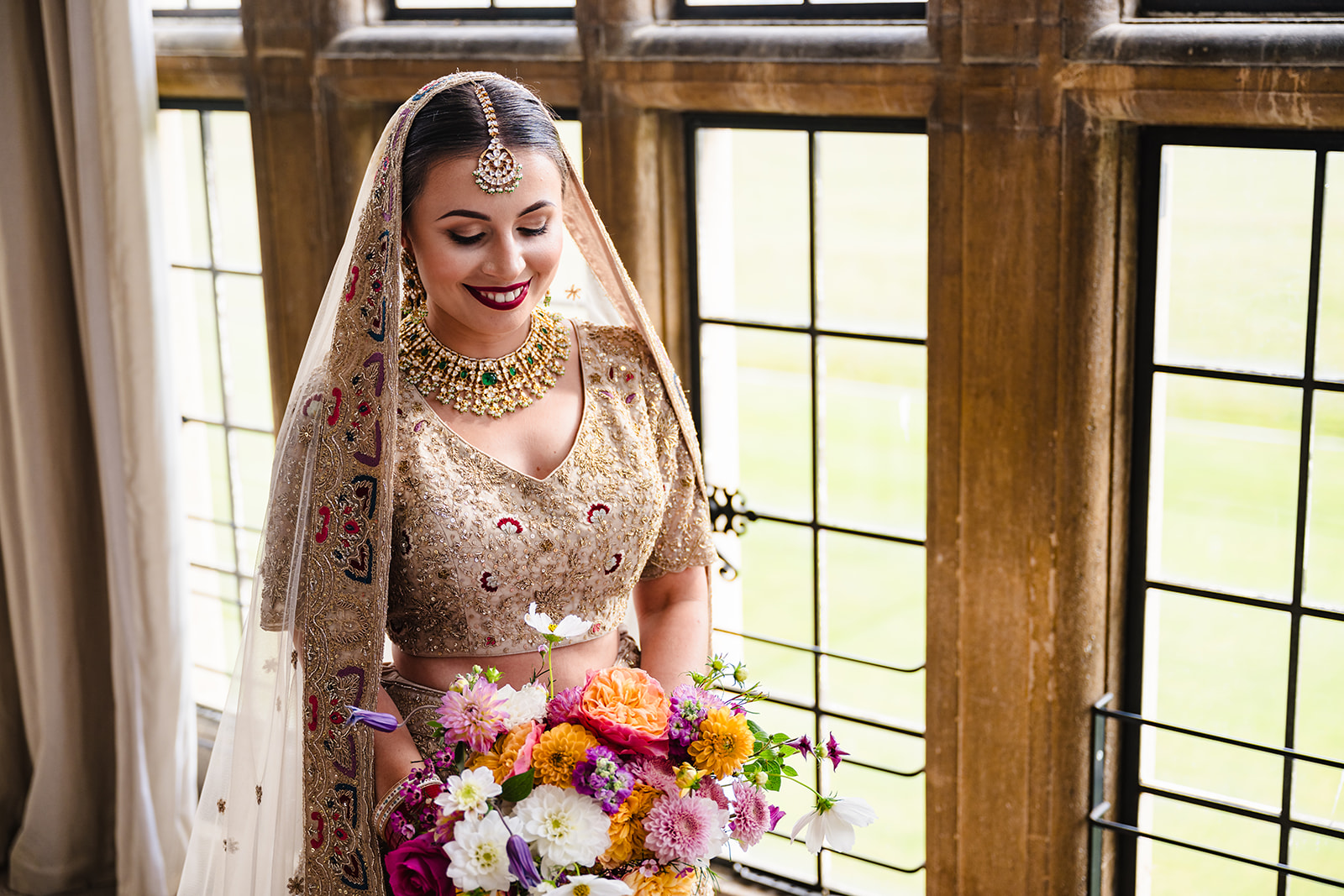 Indian Summer wedding at Stapleford Park portrait of the bride in the bridal suite by Amanda Forman Photography