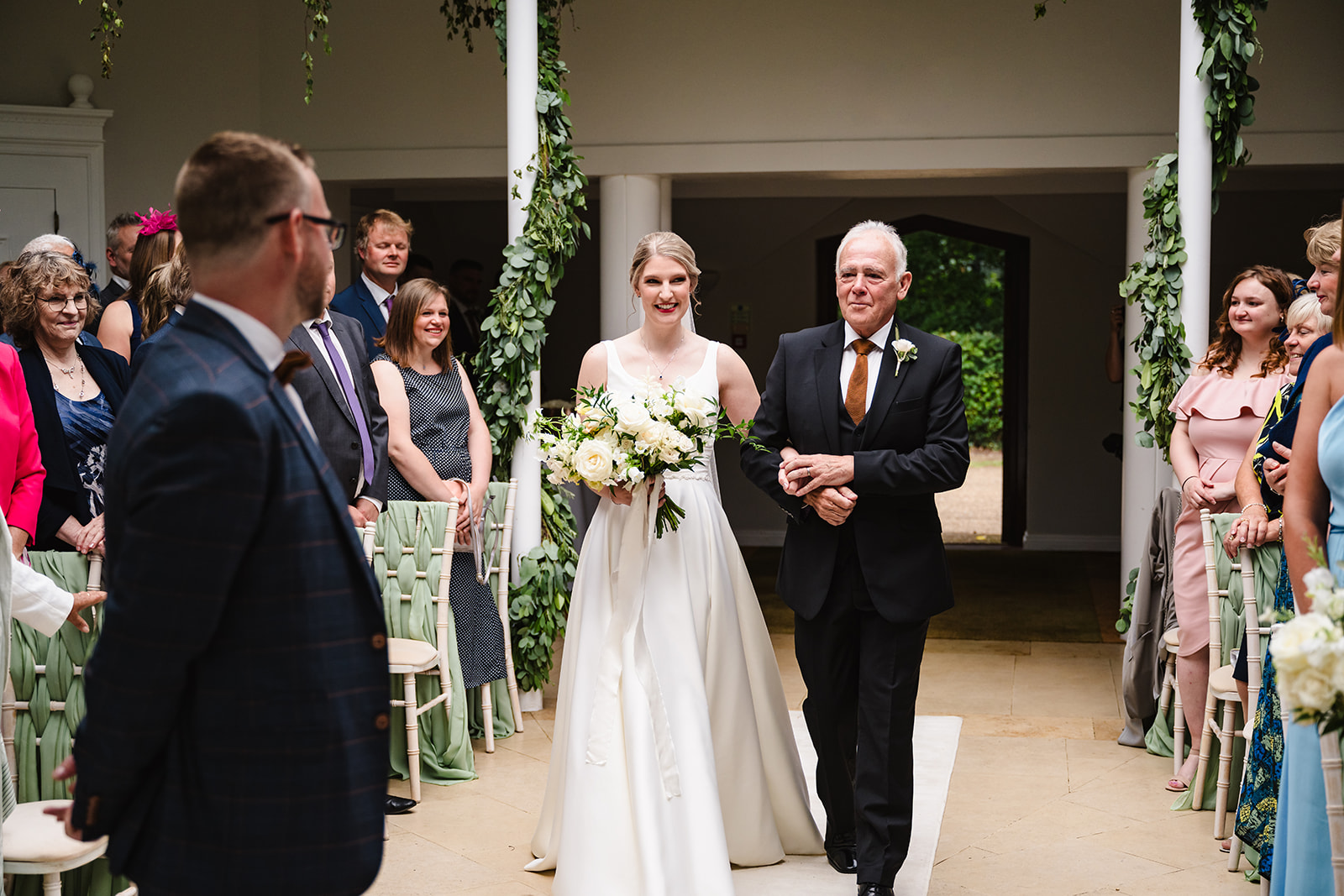 Bride and her father walking down the aisle at Stapleford Park by Amanda Forman Photography