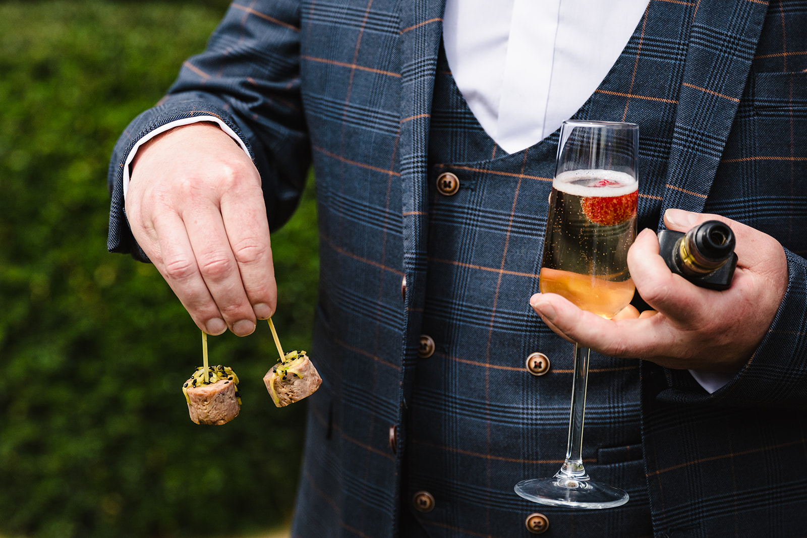 Groom with his drinks and canapes at Stapleford park by Amanda Forman Photography