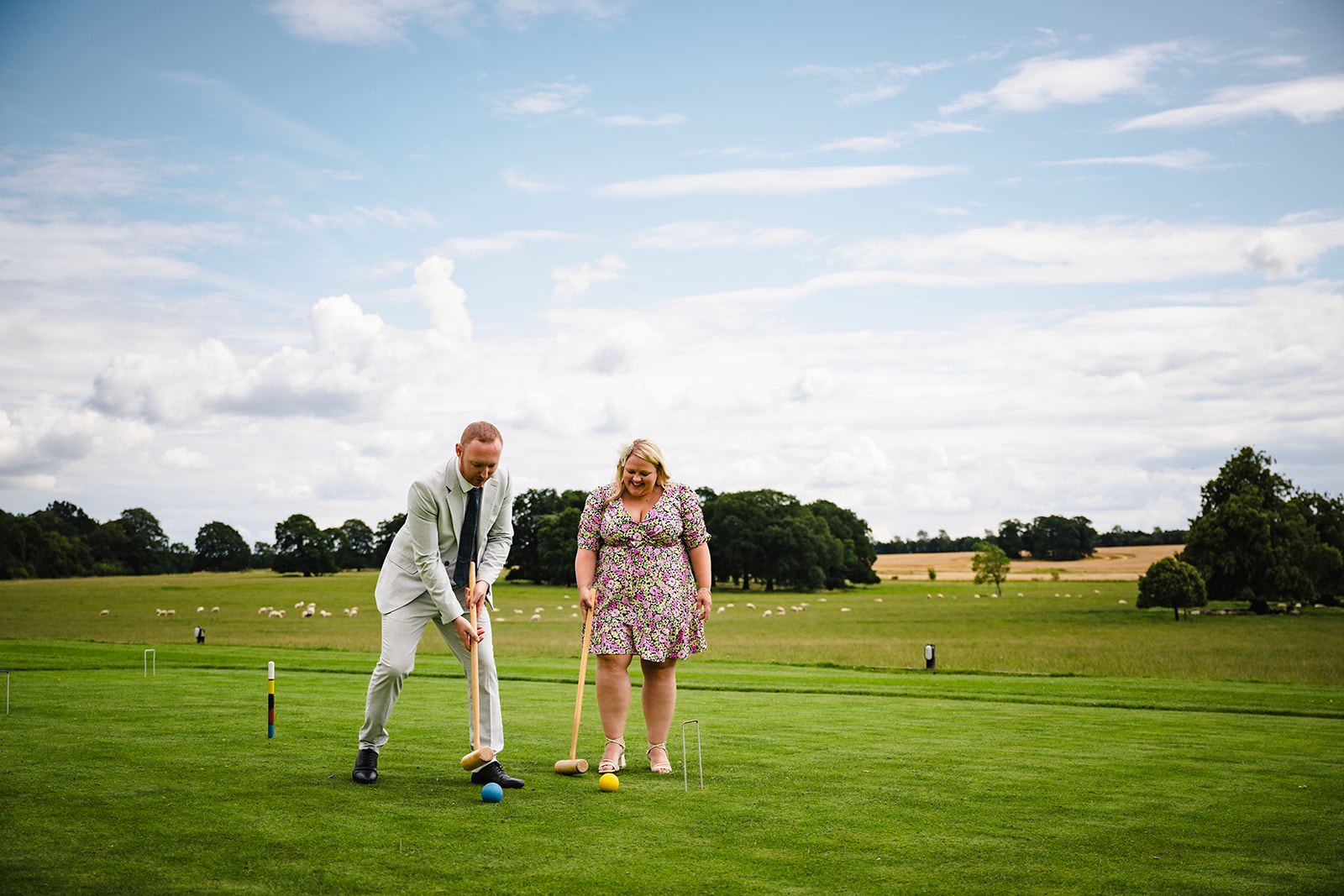 Couple playing garden games during stapleford park wedding reception by Amanda Forman Photography