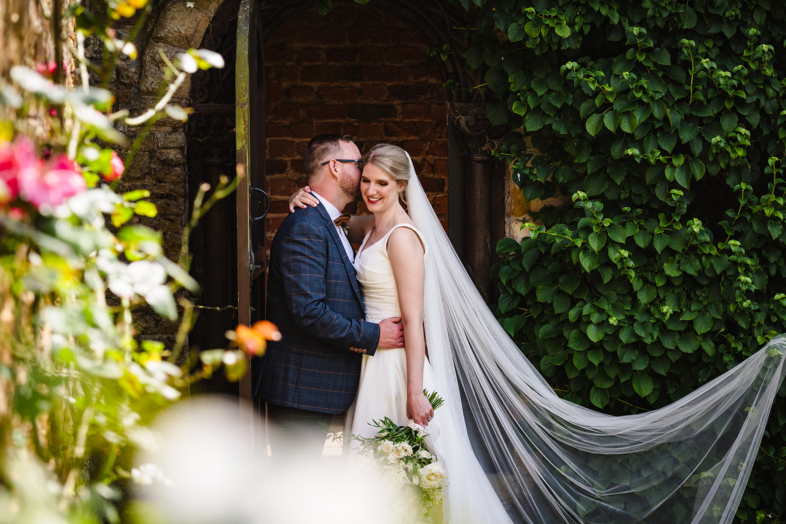 Bride and groom in the rose garden after their stapleford park wedding by Amanda Forman Photography