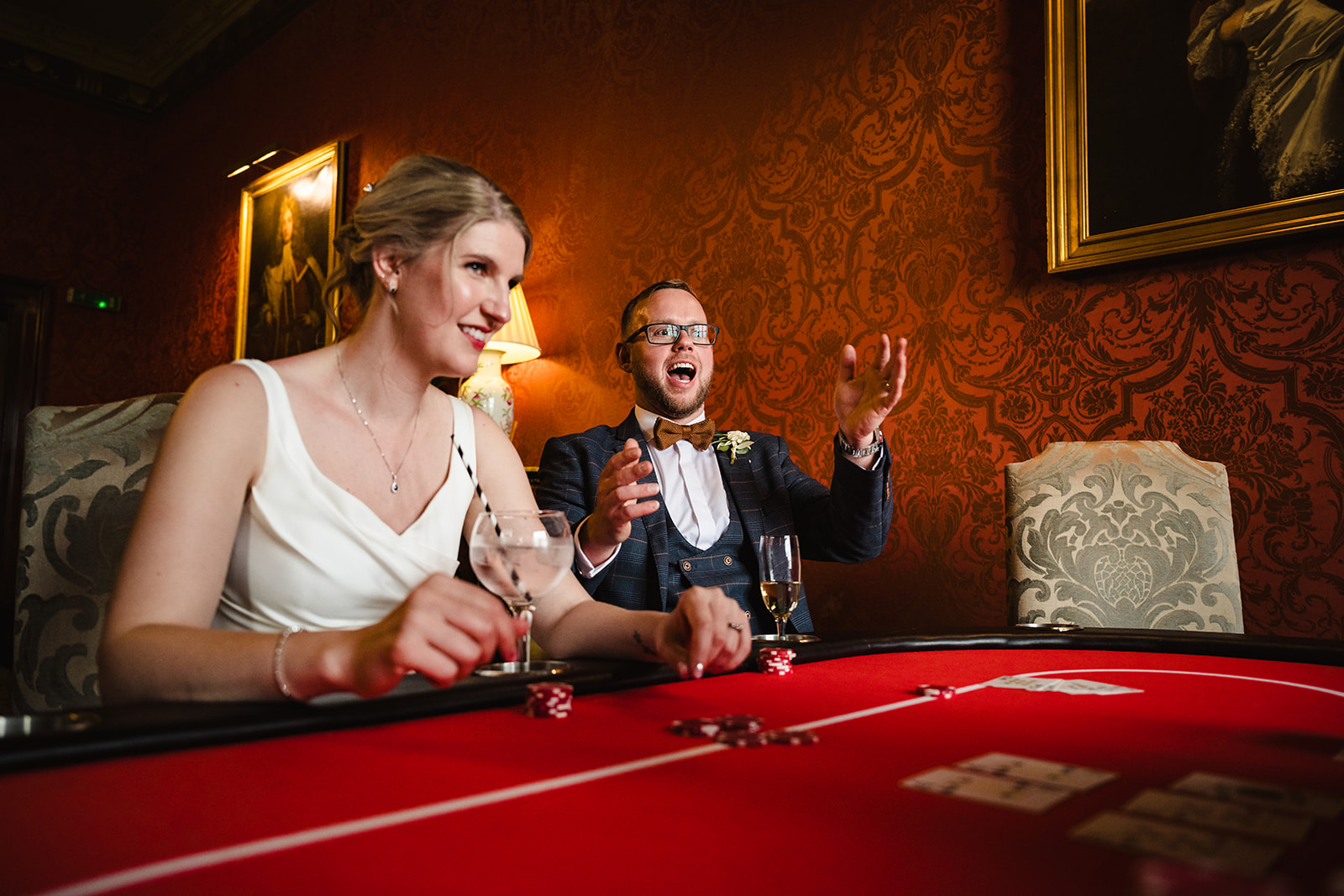 Bride and groom at the casino tables during their wedding at Stapleford park by Amanda Forman Photography